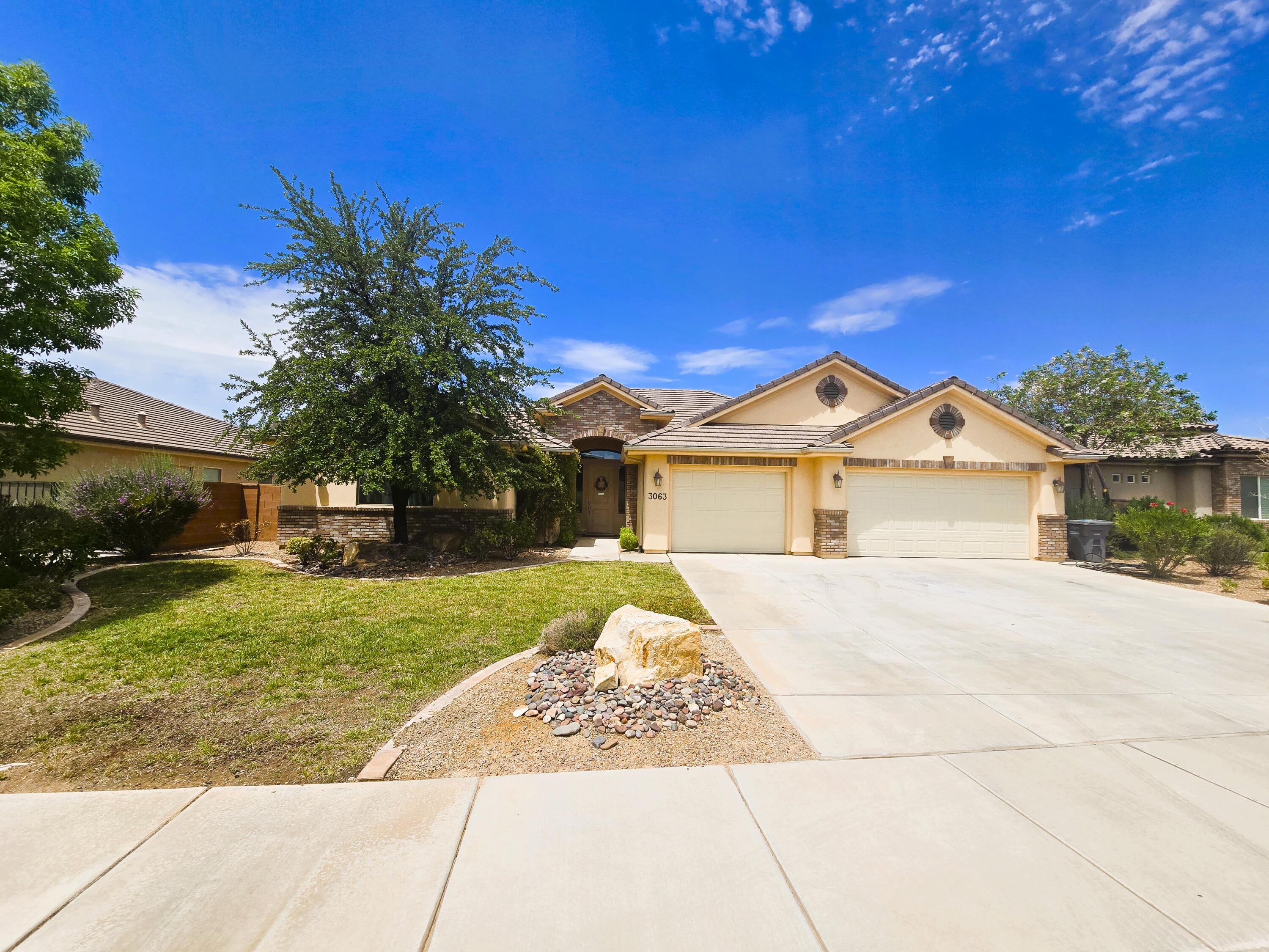 Welcome home to this beautifully maintained single-level residence in the highly sought-after Little Valley area of St. George. Offering an ideal blend of comfort, quality, and functionality, this spacious home welcomes you with soaring ceilings, abundant natural light, and an open floor plan designed for both everyday living and entertaining. The heart of the home is the impressive kitchen featuring rich wood cabinetry, granite countertops, stainless steel appliances, an oversized center island with seating, generous pantry space, and seamless flow into the dining and great room. Large picture windows overlook the private backyard, creating a bright and inviting atmosphere throughout. The spacious primary suite provides a peaceful retreat with a beautifully appointed bathroom and walk-in shower, while additional bedrooms and a versatile bonus room offer endless possibilities for guests, a home office, hobby room, or fitness space. You'll also appreciate the oversized laundry room complete with extensive counter space and storage. Step outside to a covered patio overlooking the beautifully landscaped backyard with mature trees, lush lawn, and room to relax, entertain, or simply enjoy Southern Utah's beautiful evenings. The oversized three-car garage provides ample room for vehicles, toys, and storage. Conveniently located near top-rated schools, parks, walking trails, shopping, restaurants, and world-class outdoor recreation, this exceptional home offers the perfect combination of space, location, and lifestyle. Homes like this rarely become available--schedule your private showing today before someone else calls it home.
