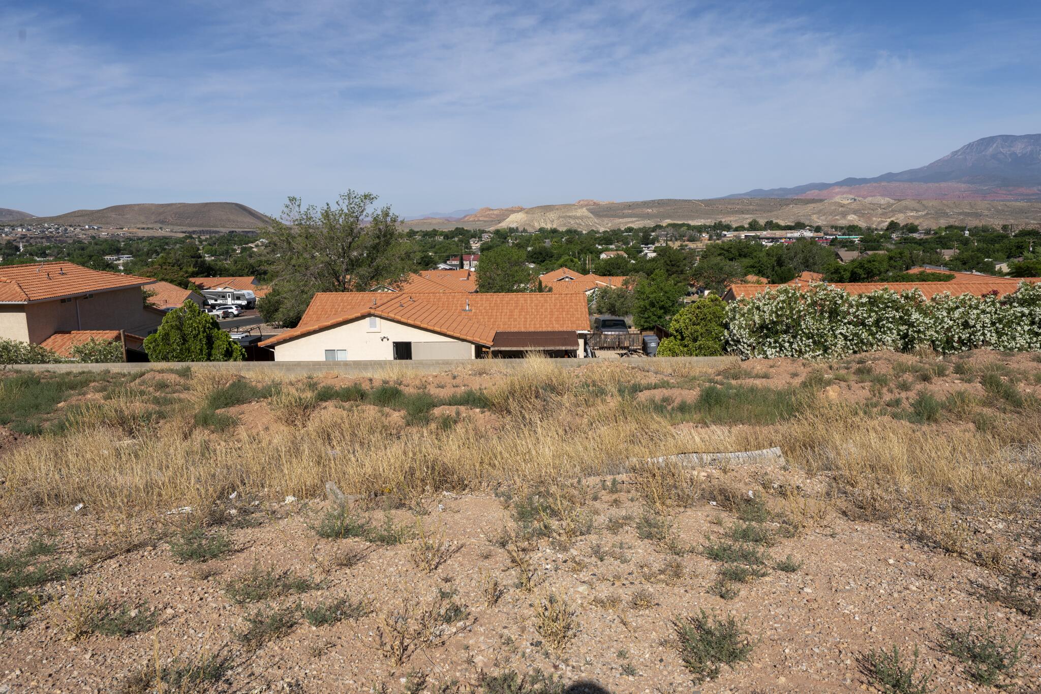 Conveniently located in La Verkin just minutes from Zion National Park, this .23 acre lot has walk-out basement potential. Providing the perfect opportunity to build in Southern Utah without the burden of HOA fees, this affordable building lot has a lot to offer. Tucked into a relaxed neighborhood, you will enjoy sweeping views of the valley and surrounding red rock mesas without paying premium resort prices.