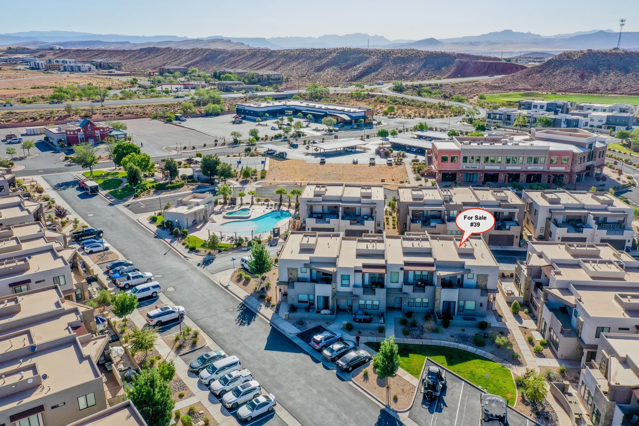 Prime Southern Utah short term rental and second home opportunity located minutes from Zion National Park, St. George Airport, Jellystone Adventure Park, Sand Hollow Reservoir, world class golf courses, and vibrant downtown St. George dining and shopping. This well maintained end unit townhome is fully furnished, turn key, and ideally positioned for high demand vacation rental traffic.

Featuring 4 bedrooms (including a main level primary suite), 4.5 bathrooms, a 2 car garage, and sleeping space for 14 guests, this property offers exceptional comfort and flexibility. Enjoy a private deck with a hot tub, fire pit, and inviting outdoor seating. The thoughtfully designed kitchen includes an oversized dining table and warm, welcoming décor ideal for large groups.

Community amenities include a pool, hot tub, splash pad, playground, and pickleball courts, plus convenient access to the only trailer parking zone and additional guest parking. STR friendly with the ability to use your own property manager, this unique townhome is loaded with amenities, activities, and unbeatable proximity to Southern Utah's top attractions.