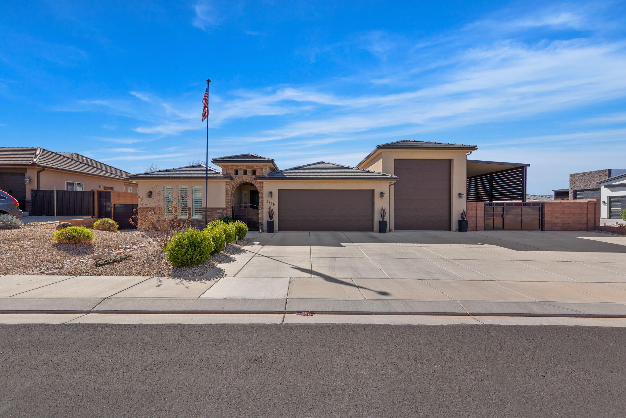Close to Sand Hollow Lake, a popular recreation and boating site. Gated front   iron gate in entry way to home and then entrance into large vaulted entry way into very large and open living room with open dining area. Large storage room with shelves. Large 2 car garage with more storage, plus huge adjoining 60' RV garage, both with painted epoxy garage floors. RV garage also has RV dump with water faucet nearby. 
Additional 57 foot covered outside parking for extra toy space for all your toys or side by side RV's or anything else.  Plus adjoining cement slab on the side  for even more parking for your toys.  Home loaded with high-end appliances, central vac, hot water recirculating system, propane cooktop w/electric oven and everything else. Granite countertops throughout, 5' jetted tub, large see through glass electric fireplace in living room. Beautiful plantation shutters throughout the home. Covered outside patio with great backyard landscaping. A true one of a kind home in Dixie Springs!!