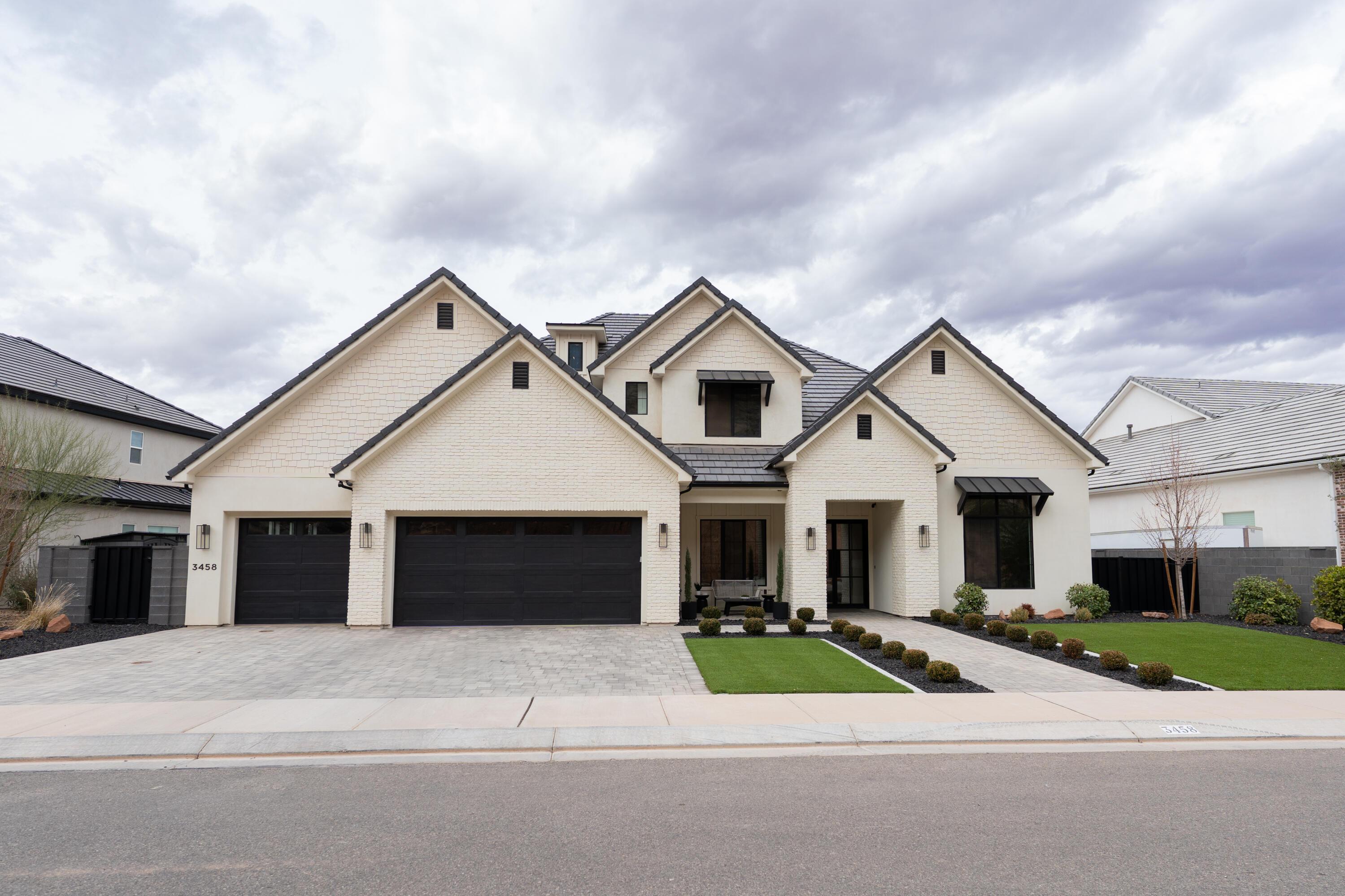 PANORAMIC VIEWS. Views of Pine Valley Mountain & the western half of St. George set the stage for this pristine New Trend Construction home in Little Valley. Nestled on an elevated lot creating extreme privacy, no neighbors behind you. Incredible backyard, featuring a saltwater pool with natural jumping rock & motorized cover, a spacious turf area large enough to easily fit a sport court, outdoor kitchen, & built-in trampoline. Large sliding glass doors & expansive windows throughout the home are thoughtfully positioned to capture the views, while tall doorways & ceilings enhance the sense of space & light. The home is tastefully furnished with Restoration Hardware furnishings & décor, available for purchase with the home under separate agreement. The stunning kitchen showcases custom cabinetry, a built-in fridge/freezer, Monogram appliances, & upgraded designer lighting. The luxurious primary suite offers sweeping views and privacy, a walk-in shower, & custom closet. The thoughtfully designed floorplan includes two bedrooms, a dedicated living room, office, & flex room on the main level, along with a second laundry room, second family room, & bonus room. A truly one-of-a-kind property offering views, design, & functionality. This is a home not to be missed! offers sweeping views, a walk-in shower, & custom closet. The thoughtfully designed floorplan includes two bedrooms, a dedicated living room, office, & flex room on the main level, along with a second laundry room, second family room, & bonus room. A truly one-of-a-kind property offering views, design, & functionalitythis is a home not to be missed.