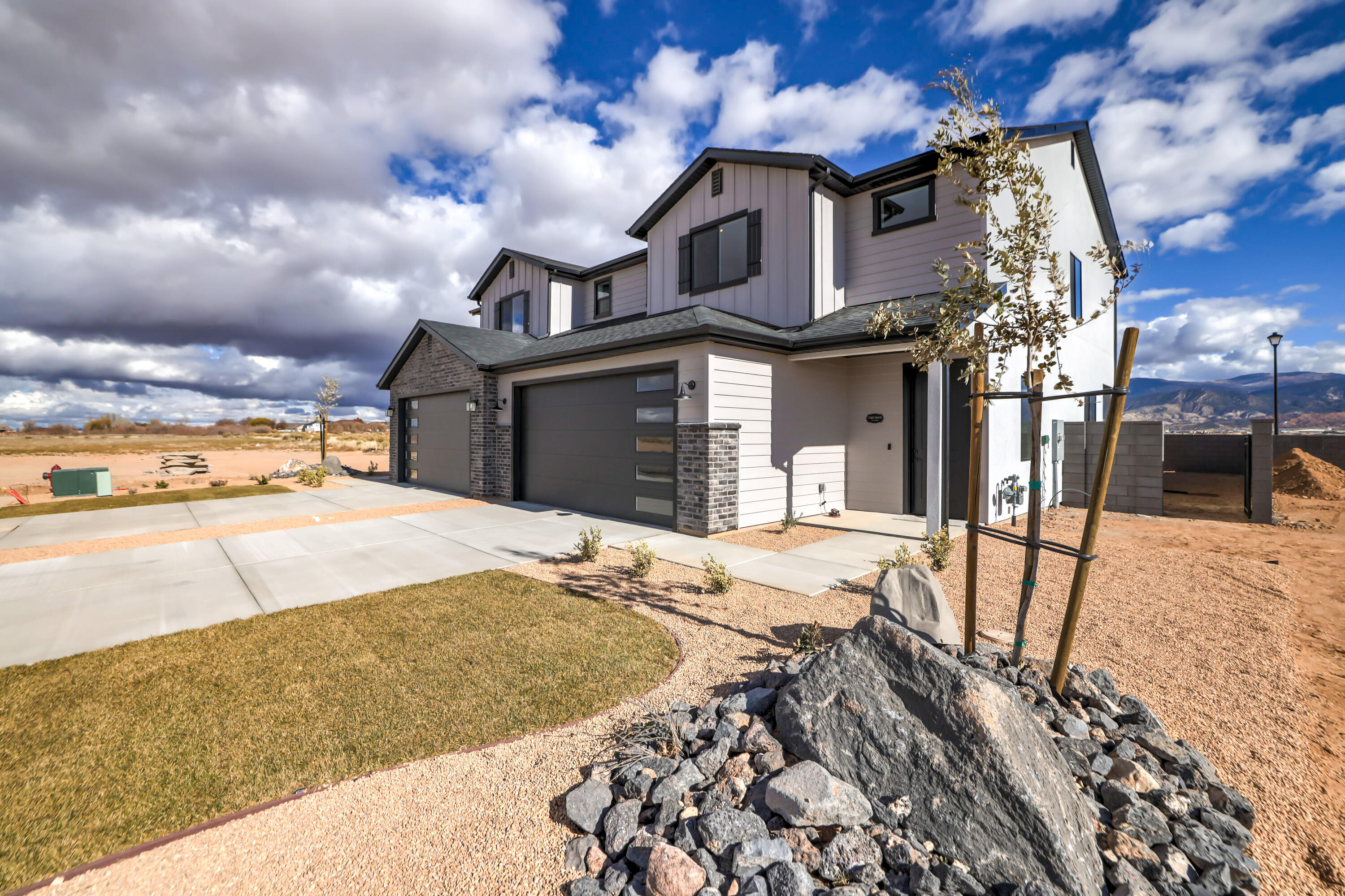 A hard to find FOUR bed Twin home. This plan is 1806 sq. ft., with a large Master Bedroom & a spacious Master Closet. A perfect use of space everywhere you go in this plan. Open and light Main Floor with built in desk by Kitchen, large Family Room area, Covered Patio, Fireplace, Enclosed yard, Fridge included. No HOA. This home sits on a corner lot so the front and back yards are slightly bigger than the others on the street. Magnolia Fields sits in a beautiful, scenic location with views and open space. It is Cedar City's newest neighborhood with a range of floor plans to fit your needs. Pictures are of similar home.
