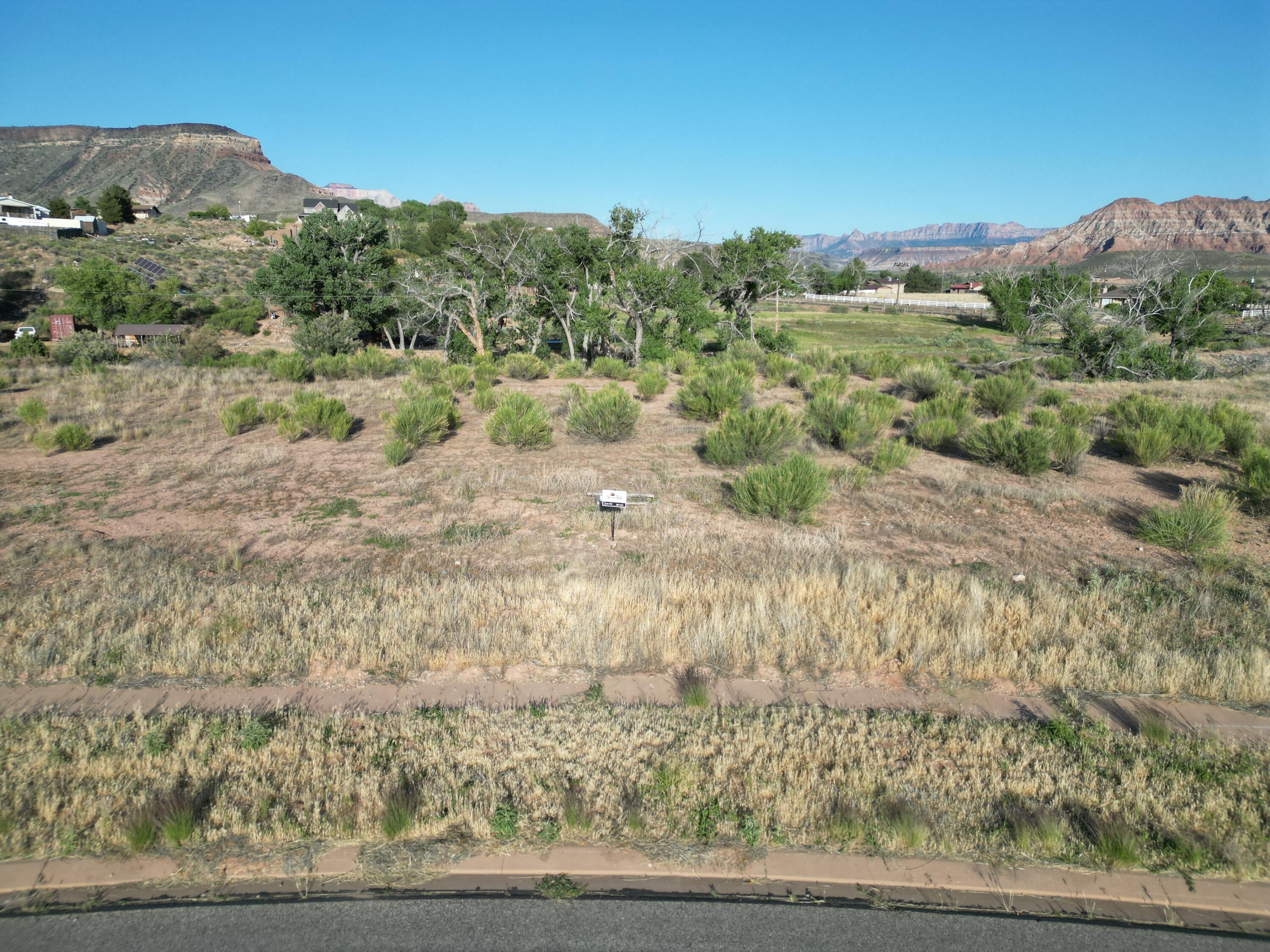 New Phase Release - Premium 1+ Acre Lots Now Available! Visit our brand-new sales office at Sierra Bella in Virgin, Utah, just minutes from the entrance to Zion National Park. This is your opportunity to own a slice of Southern Utah paradise! These fully improved 1+ acre homesites offer breathtaking views of the iconic Zion mesas and a rare rural residential setting--perfect for building your custom dream home. With approved builders ready to go, you can begin the building process right away. Each lot includes: One share of pressurized irrigation water Culinary water connection Fully improved homesite Washington County Water Conservancy impact fees already paid Prices start at just $235,000. Don't miss this limited opportunity to secure your place in one of Southern Utah's most desirable communities. All information is deemed reliable but not guaranteed. Buyer is responsible for verifying all information.