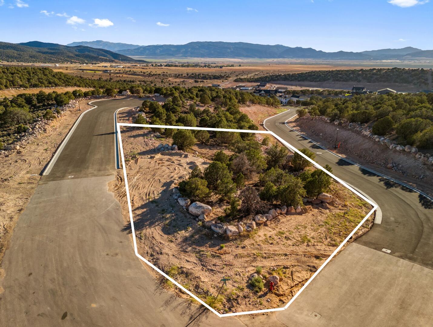 This is Lot Number 19, a .53-acre homesite located in the highly sought-after Estates at South Mountain subdivision. Enjoy stunning views of Shurtz Canyon and the surrounding Southern Utah mountains. This growing community is positioned near planned future elementary, middle, and high schools, adding long-term value and convenience. Bring your own builder or choose to build with the South Mountain Development Group. Don't miss this opportunity to secure a premium lot in one of Cedar City's most desirable neighborhoods. No HOA.