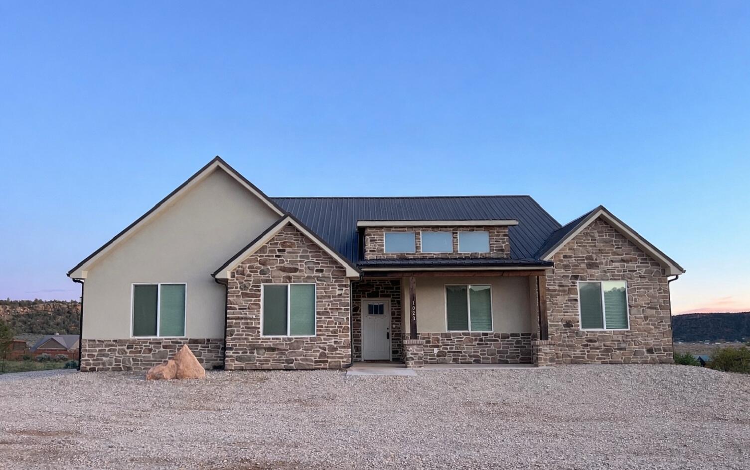 Welcome to this stunning custom-built home completed in 2023, perfectly situated on a full 1-acre lot in the scenic beauty of Apple Valley, Utah. Offering 4,141 square feet of thoughtfully designed living space, this property combines modern construction, flexibility, and the peaceful charm of Southern Utah living--all with the reliability of stable city water.

No expense was spared in the design and build of this home. The custom kitchen is a true centerpiece, featuring custom cabinetry, granite countertops, stainless steel appliances, double ovens, and a hidden pantry that adds both style and functionality. From quality finishes to a well-planned layout, every detail reflects craftsmanship and intentional design.

The main living area is anchored by a large brick fireplace with a wood-burning stove, creating a warm and inviting focal point for cozy evenings.

The home includes a fully finished basement and a private casita, making it ideal for multi-generational living, guests, or rental income.

Enjoy the freedom of space and rural living with horse-friendly zoning, giving you the ability to create your own desert retreat. The surrounding landscape showcases some of the area's most breathtaking features, including expansive mesas and unforgettable sunsets that paint the sky each evening.

Located minutes from some of Southern Utah's best outdoor recreation, you'll have easy access to nearby trails for hiking, biking, horseback riding, and off-road adventures. The area is known for its quiet atmosphere, wide-open spaces, and proximity to destinations like Gooseberry Mesa, Zion National Park, and Sand Hollow State Park.

As an added bonus, Gooseberry Way is planned to be paved in the near future per the mayor, enhancing accessibility and long-term value.

If you're looking for a newer custom home with room to grow, incredible views, and access to world-class outdoor recreation--with dependable city utilities--this Apple Valley property delivers.