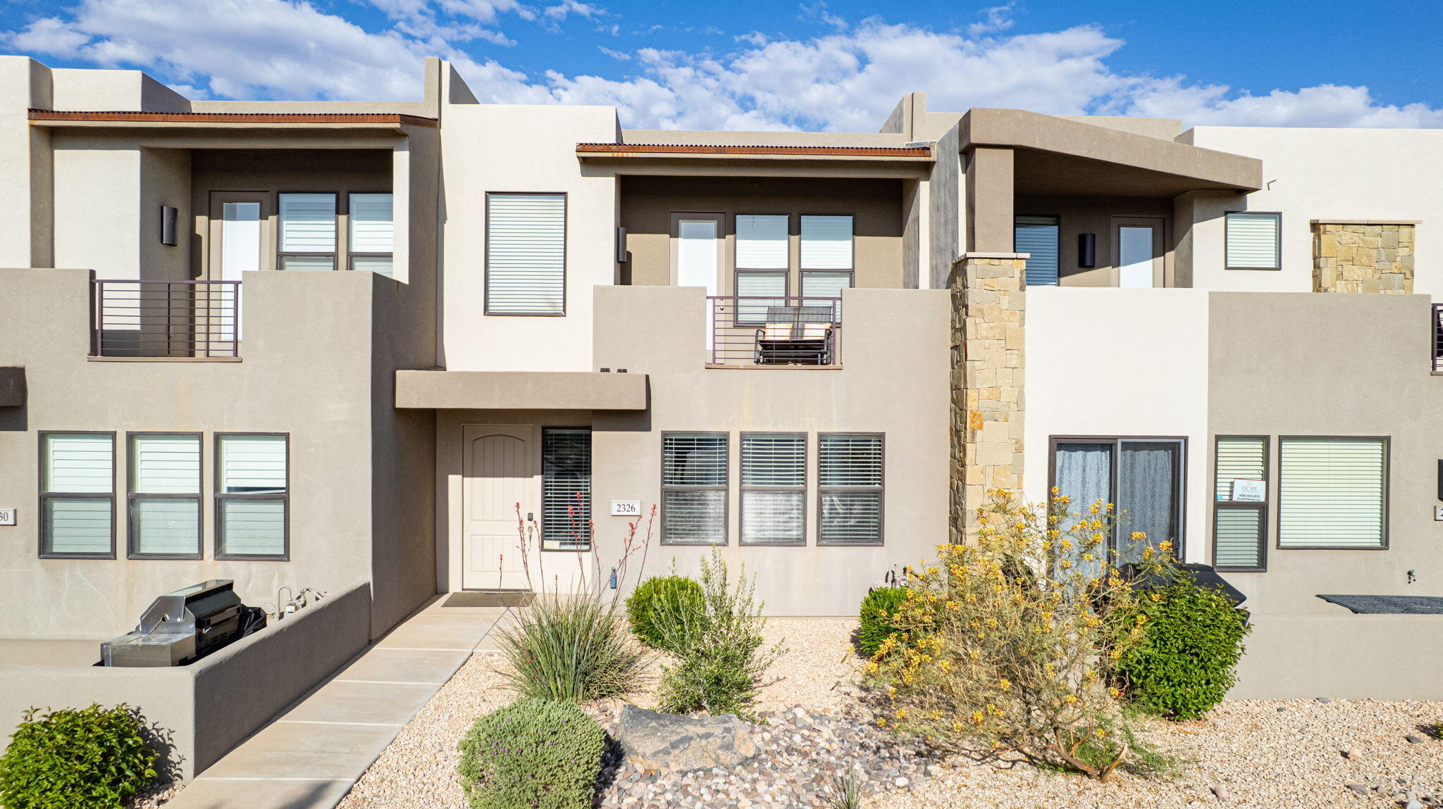 Capitalize on a 100% approved short-term rental asset in the Town Center at Coral Canyon. This turnkey townhome is sold fully furnished with an established track record of past and returning guests. The floor plan features a primary suite on the main level, spacious living areas, and a two-story layout optimized for guest capacity. An upstairs outdoor balcony provides a dedicated sitting area for guests to take in the surrounding landscape. Situated 30 minutes from Zion National Park and 15 minutes from downtown St. George, the location provides immediate access to regional golf, water sports, and hiking. Community amenities include an on-site swimming pool, hot tub, and pickleball courts. Come and take a look and book your showing today.