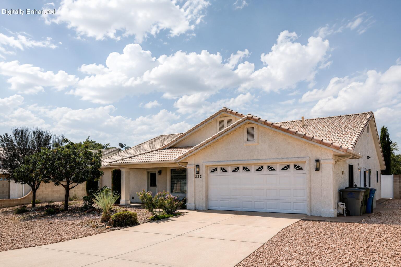 Welcome to Elfin Cove, a peaceful and inviting 55+ community in the heart of Ivins. Tucked along a private street with minimal traffic and noise, this small neighborhood also features a residents-only park near the entrance, providing a convenient outdoor space for homeowners and their pets.

Thoughtfully maintained and updated, this home is truly move-in ready. The refreshed kitchen features new cabinetry, countertops, stainless steel appliances, and a large pantry. Updated tile and wood-look flooring create a clean, cohesive feel throughout the home.

Storage is abundant, with multiple closets, walk-in bedroom closets, and plenty of space to keep everything organized. The oversized laundry room offers additional flexibility and could easily serve as a craft room, hobby space, or extra storage area.

At the rear of the home, a spacious sunroom looks out over a private, fully blocked backyard with a large shade tree, palm trees, and rose bushes.  The sun room walks out to a concrete patio, creating multiple places to relax, entertain, or simply enjoy Southern Utah's beautiful weather. The low-maintenance backyard features , with no grass to water or maintain.

The third bedroom, complete with its own half bathroom, is located separately from the main living areas and is accessed from the sunroom. This private arrangement creates a comfortable space for guests, a home office, a studio, or a quiet personal retreat.

 At $40/mo, the low HOA dues make this home accessible for many buyers.