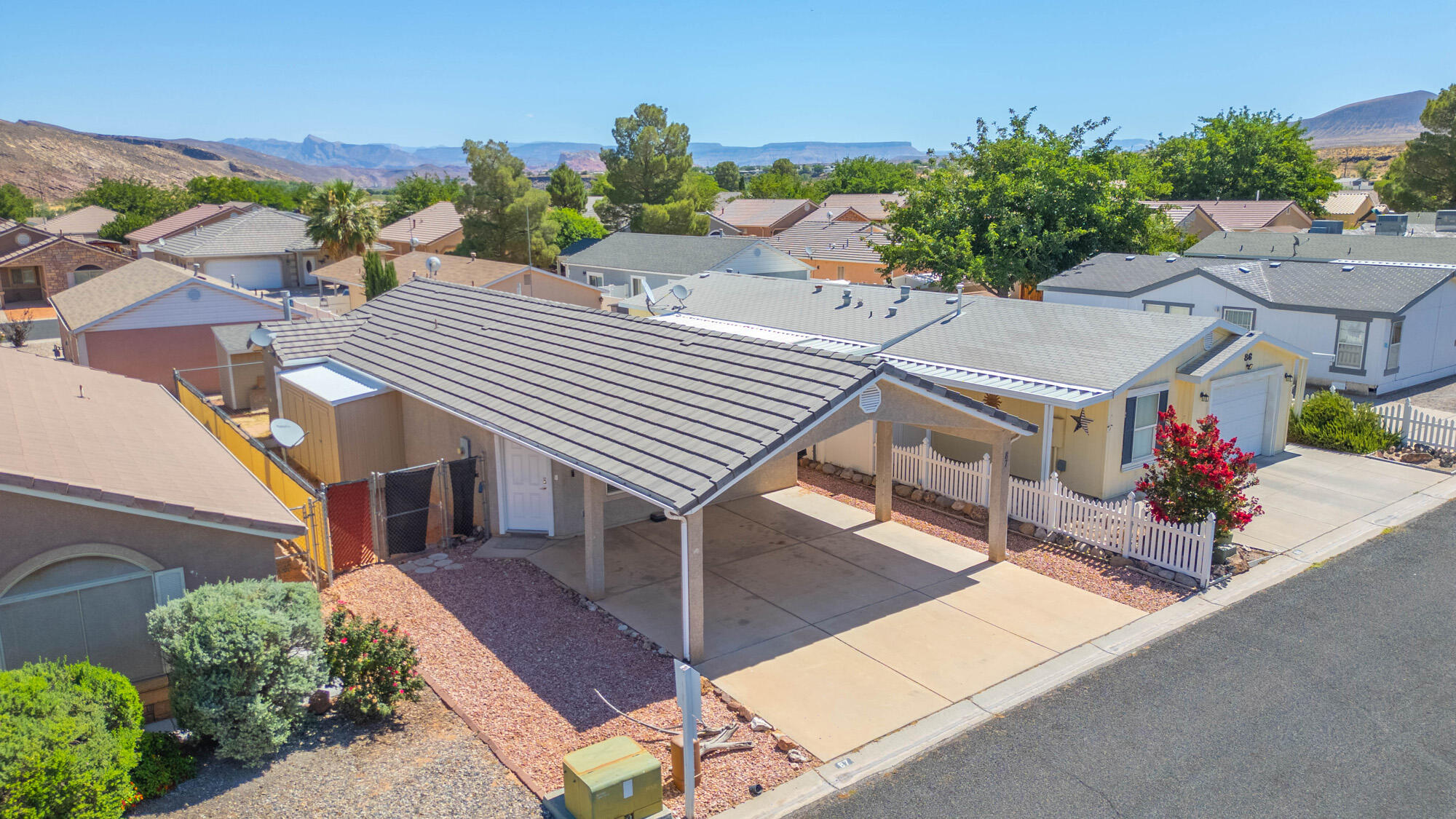 Charming, Updated & Turn-Key! Look no further for super clean, affordable living in a prime location. This beautifully updated 2-bedroom, 2-bathroom stick-built home is completely move-in ready with fresh paint, brand-new carpet, newer A/C unit and pristine new appliances throughout. Whether you are looking for the perfect starter home, a low-maintenance second home, or a base camp for adventure, this property delivers. Residents enjoy fantastic community amenities, including a sparkling pool, clubhouse, and playground. Situated just minutes from local shopping and an easy drive to the breathtaking Zion National Park. Don't miss out on this affordable gem--schedule your showing today!