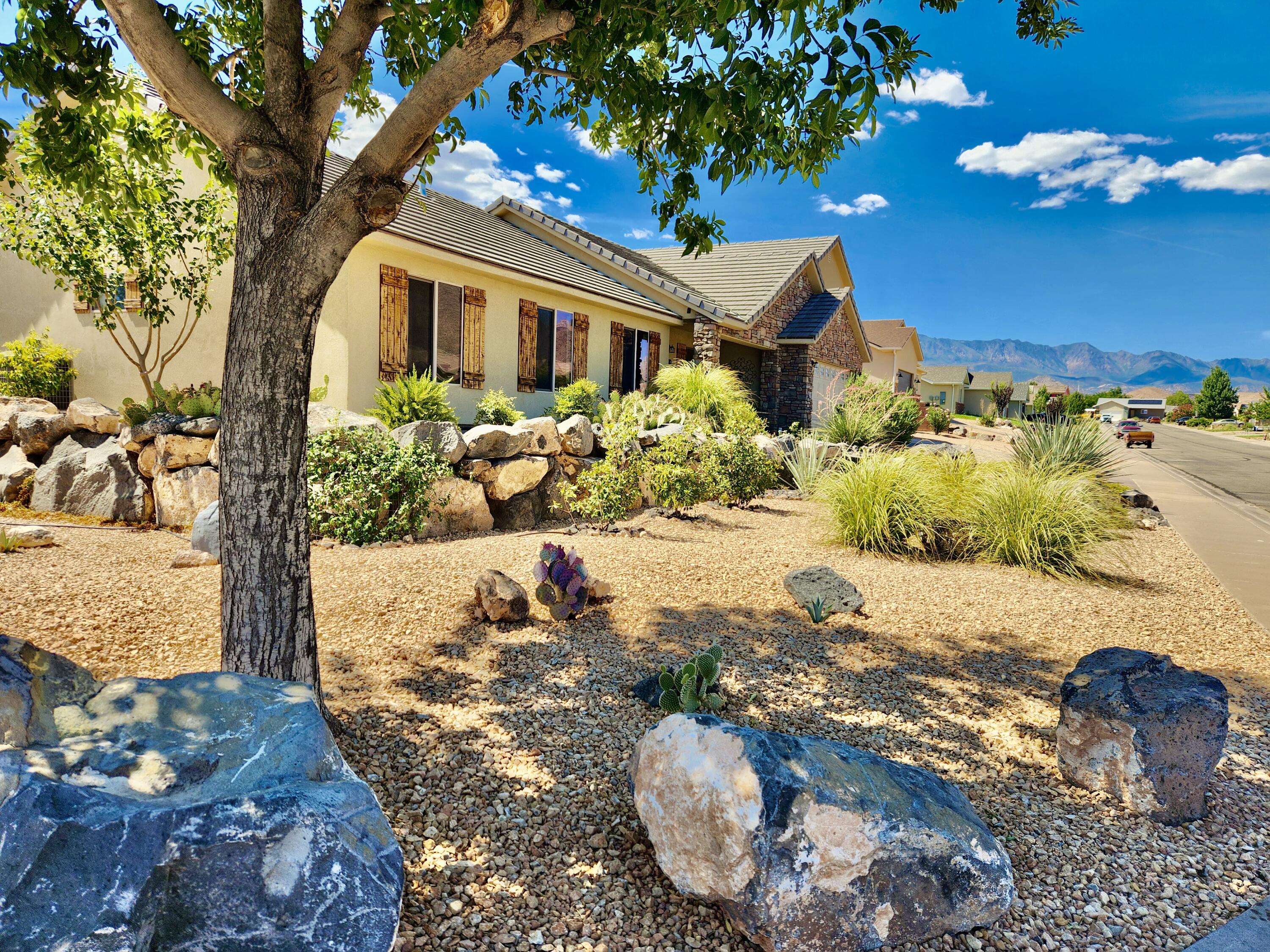 Assumable 2.25% loan!!! Save$1000 a month vs 6.5%! Don't miss out! In a quiet town 25 minutes from Zion Park, this 5 bed 3 bath home is fully xeriscaped with a large, private fully enclosed yard. . Great floor plan with separate office space for remote workers. You'll find room for the whole family and an extra large master suite with 2 walk in closets!
Bonus...monthly income potential with the attached ADU/guesthouse - could off-set your mortgage! Great for mother-in-law suite, older teen, or short or long-term rental. Earns almost $20k in rental income.
3 car garage plus additional RV parking. Centrally located between St George & Cedar City. Close to tons of outdoor activities. Views of Pine Mountains and towering buttes