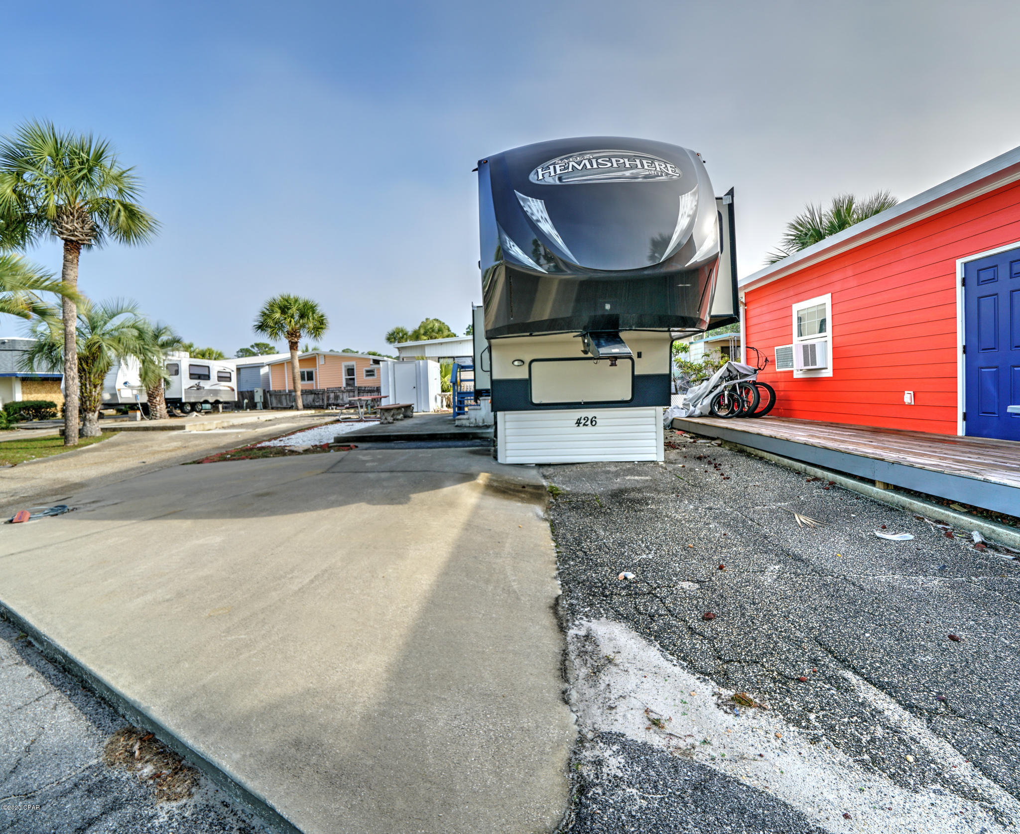 Check out this beautiful lot in highly sought after Venture Out.  This lot will come with a 41' 2014 Salem Hemisphere 5th wheel complete with 4 Slides and awning. 5th wheel has nice size master with on suite and a cool bunk room. There's also a 1/2 bath of the kitchen. Great central location within the resort. Build your dream home or hang out in the 5th! This one won't last long! Venture Out offers BOTH beach and bay access! The resort also has 2 pools, tennis, golf, shuffleboard, playground, basketball, fishing pier, boat dock with slips & boat ramp. Venture Out is a golf cart community that has exploded in popularity within the last few years. A gated, pet friendly community that's great for full time residency or just to vacation. 24 hour security & friendly atmosphere. It's all her