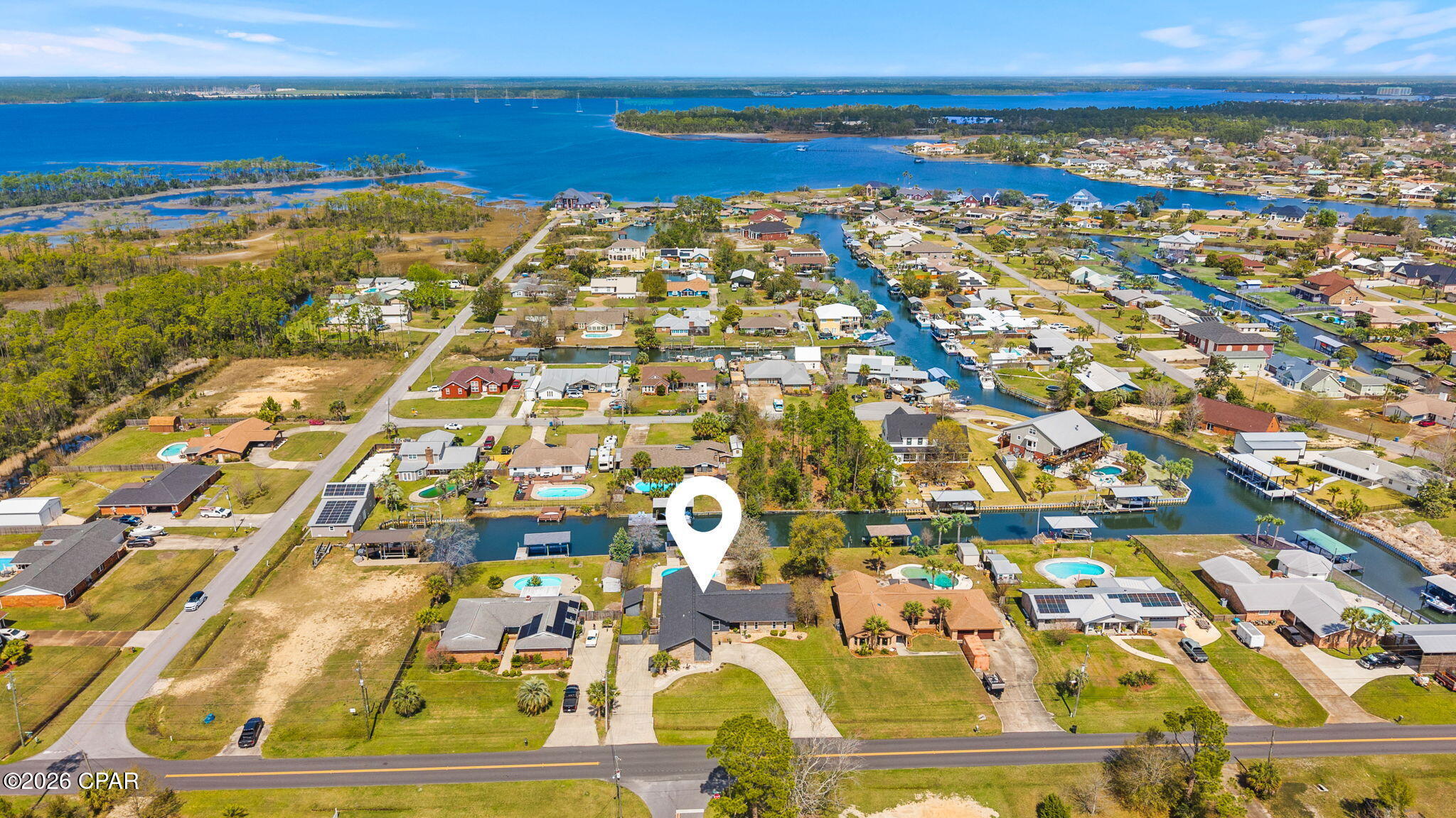 There's something about the water!
One level. One Owner. Built to be lived in and loved for generations. This WATERFRONT OPPORTUNITY now offers a brighter, more inviting feel. The interior enhancements complements the home's true coastal culture with a private pool, canal frontage, and a covered dock--perfect for fishing, boating, and unwinding by the water. Pack your picnic and head over to Shell Island. The residence features 4 bedrooms and 2.5 baths, including a flex room conveniently located just inside the entry from the drive-through garage, opening on both sides to create a porte-cochère style arrival and exit. No HOA This NorthShore waterfront home is ready for its next chapter and offers an exceptional opportunity along the Emerald Coast
(Buyer to verify all dimensions, measurements, fees & written information).

Top Features | Property Highlights
- Hidden panel Bosch dishwasher seamlessly integrated into the island for a sleek look and ultra-quiet performance
- Premium JennAir cooktop
- Brand new, never-used Samsung double-door microwave/convection oven
- Samsung refrigerator in like-new condition
- High-efficiency HVAC system
- New drywall with double insulation Top Features | Property Highlights
- Hidden panel Bosch dishwasher seamlessly integrated into the island for a sleek look and ultra-quiet performance
- Premium JennAir cooktop
- Brand new, never-used Samsung double-door microwave/convection oven
 - Samsung refrigerator in like-new condition
- High-efficiency HVAC system
- New drywall with double insulation