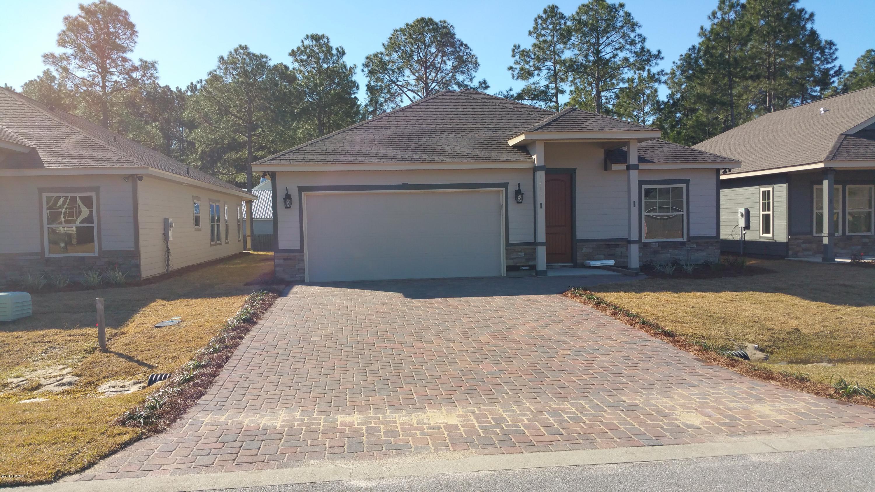 New Construction at Hidden Ridge! SELLER WILL PAY $5000 TOWARDS CLOSING COSTS!! Should be finished by 20 May 15. Hidden Ridge is a New 21 Home, Secluded Subdivision in Lynn Haven off Hwy 390. Hidden Ridge has Underground Utilities, Paver Driveways, Sidewalks and Decorative Street Lights. This Home will be completed in approximately 10 days. This beautiful 4 Bedroom, 2.5 Bath New Construction Home features 9/10 Foot Ceilings, 20 inch Porcelain Tile Flooring throughout Main Living Area and Bathrooms. The Kitchen has All Wood Cabinets, Granite Counter Tops with under Mount Sink, Breakfast Island and Whirlpool Stainless Appliances. Some of the Standard Features include: Tremendous Master Walk-In ''Step Down'' Showers with 2 Shower Heads, 8ft Interior Doors, Crown Molding,

Paver Driveways, Upgraded Carpet and Pad, 14 SEER Heat Pumps, Anderson LOW E Double Paned Windows, Radiant Barrier Roof Decking (Reflects Heat Away), and a Security System. Put Hidden Ridge and this wonderful New Home at the Top of your List of Places to See.