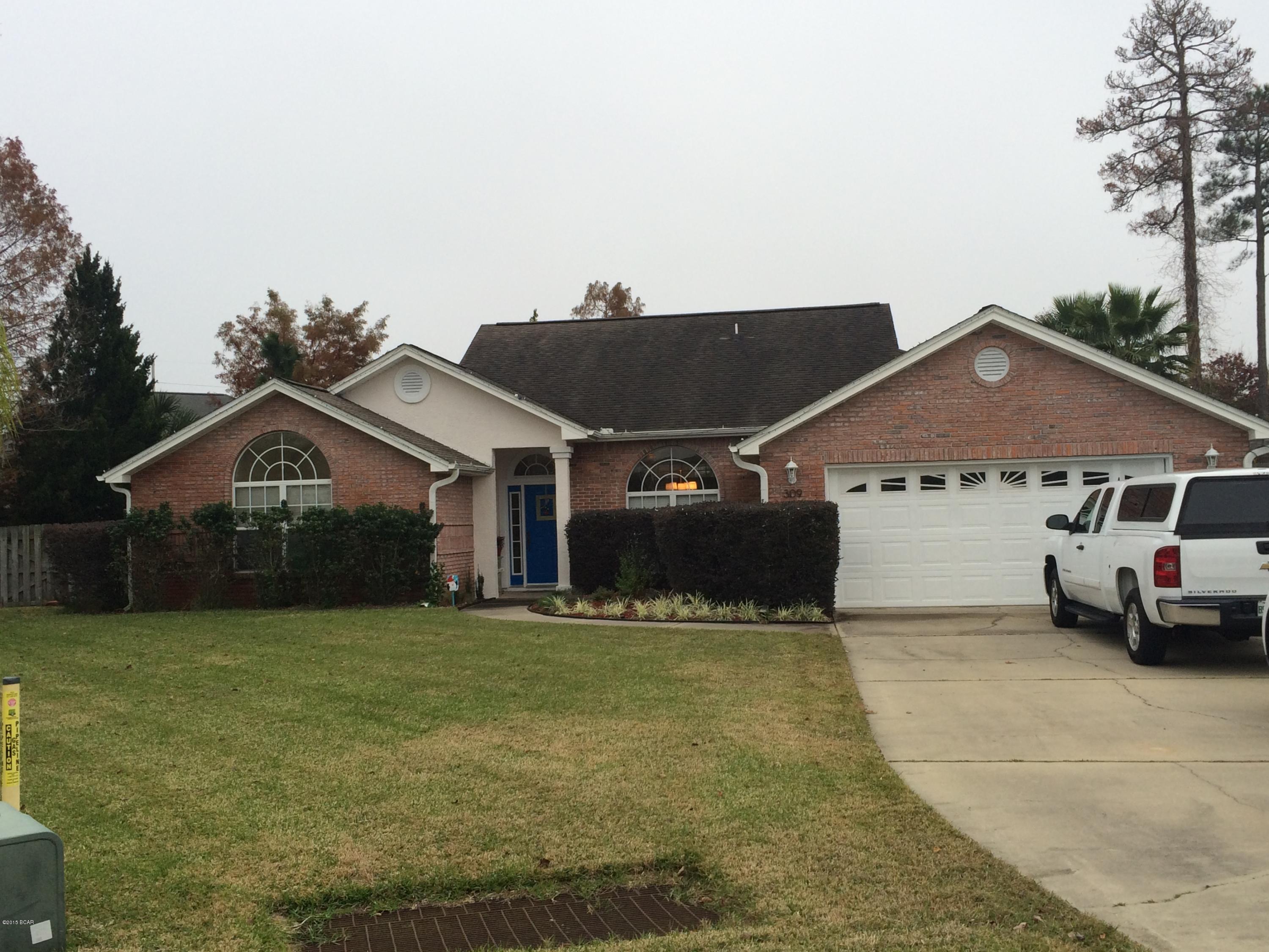 Great house in the Hidden Pines subdivision - Just a few blocks from the Navy Base. This 4 bedroom 2 bath brick home features a well manicured lawn, 2 car garage, fire place, covered patio, fenced back yard, and hard wood floors. It is a split bedroom plan with a formal dining room, an open kitchen with lots of tile, and raised ceiling with molding.