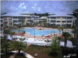YOU WILL FEEL LIKE YOU ARE LIVING IN A RESORT..ONE of the ''Prettiest'' 2's IN COMPLEX & 3rd Floor Large Balcony no one above you all one level large open floor plan. ..the Amenities are one of the main reasons why most people live here full time. No Vacation rentals allowed. PERHAPS LARGEST POOL IN BAY COUNTY (1 acre) w/ two waterfalls, SPLASH PAD and spa plus numerous seating arrangements for your poolside entertaining... all on one level AND ELEVATORS AVAILABLE IN THE BUILDING This 2 bed 2 and a half bath unit is by far the best priced in Island Reserve. This unit has 2 Master Suites lots of storage area with walk in closet and each bedroom has a door to the large private patio overlooking the back close to the 1 acre pool There are floor to 10ft ceiling windows in the living room