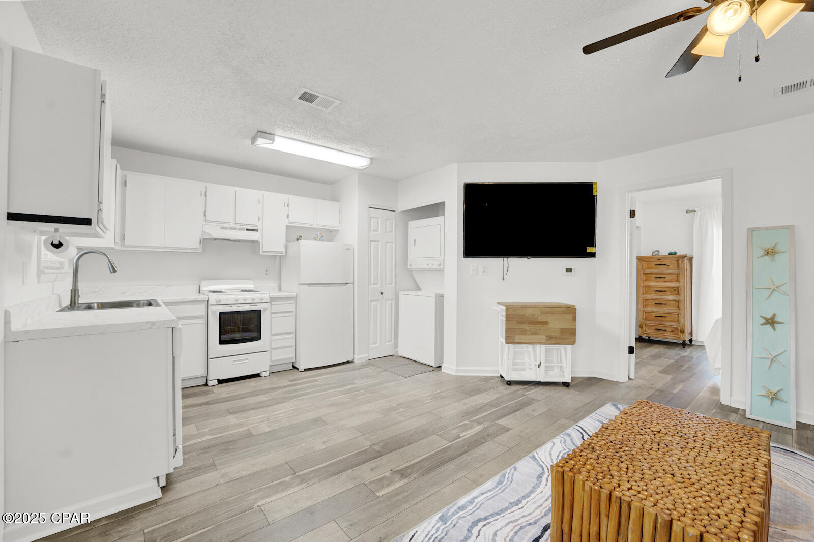 Turn key- 1 bedroom 1 bath beach condo, Ready for short term rentals, newly updated top to bottom!  Fresh paint, new counters, painted cabinets etc. The condo has a view of pool from patio. Peek a boo views of Gulf of Mexico! Beach access across the street. Walking distance to groceries, the NEW McGuires restaurant, and shopping. HOA includes garbage, cable, and lawn care. Condo being sold as is. All measurements are approx. and should be verified if important.