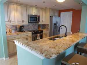 INVESTORS!! LUXURY INVESTMENT. This must see 1-of a kind custom 2 bed/2 bath condo at Long Beach resort! Origninal floor plan has been redesigned to give the owner a walk around custom kitchen with awesome views. Kitchen has all new stainless steel appliances including a built in wine/ beverage cooler. New travertine floors throughout! This unit has 2 Master bedroom suites which are both located on the Gulf! Both bedrooms have balcony access and have floor to ceiling windows! Too many upgrades to list. Open living area with floor to ceiling glass also. Long Beach Resort has 3 pools, one of which is a beautiful lagoon style pool with waterfalls, plus 3 hot tubs! On rental program. For the Investor buyer this condo's 2013 GRI $44k+, 2014 first 8 months GRI $38k+, 2015 GRI projection