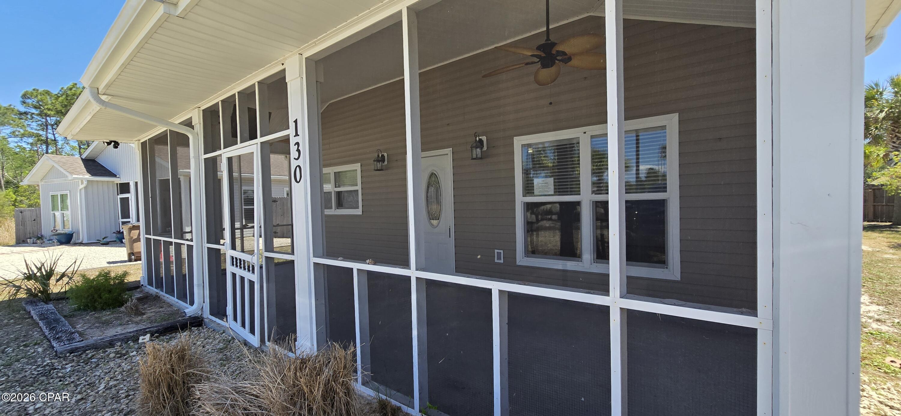 **Multiple Offers Exists, All Highest and Best Offers Due by  04/16/2026 01:00 PM CST** 
Welcome to your next favorite beach getaway! This charming 3-bedroom, 2-bathroom coastal cottage is sitting pretty in the Highlands at St. Joe Beach, and it's ready to steal your heart.

Inside you'll find 1,200 square feet of laid-back living with an open concept layout that just feels right. The vaulted ceiling in the living room gives everything an airy, breezy vibe, while the primary bedroom features a gorgeous coffered ceiling that adds a touch of elegance. Wood laminate flooring flows throughout the home, and the bathrooms are decked out with modern tile and updated fixtures. The kitchen comes equipped with stainless steel appliances, making meal prep a breeze after a long day soaking up the sun.

Speaking of sun, you're less than half a mile from the beach. Grab your golf cart because this community is totally golf cart friendly. Windmark Public Beach access is just a short distance away, so sandy toes are practically guaranteed.

Outside, you'll love the screened front porch for sipping morning coffee, a privacy-fenced backyard for hanging out, and a detached storage building for all your beach toys and gear. The home connects to city water and sewage, and here's the cherry on top -- no homeowners association fees to worry about.

Painted in beautiful coastal colors and perfectly positioned in one of Florida's most relaxed beach communities, this cottage is calling your name. Don't let someone else answer first -- schedule your showing today!