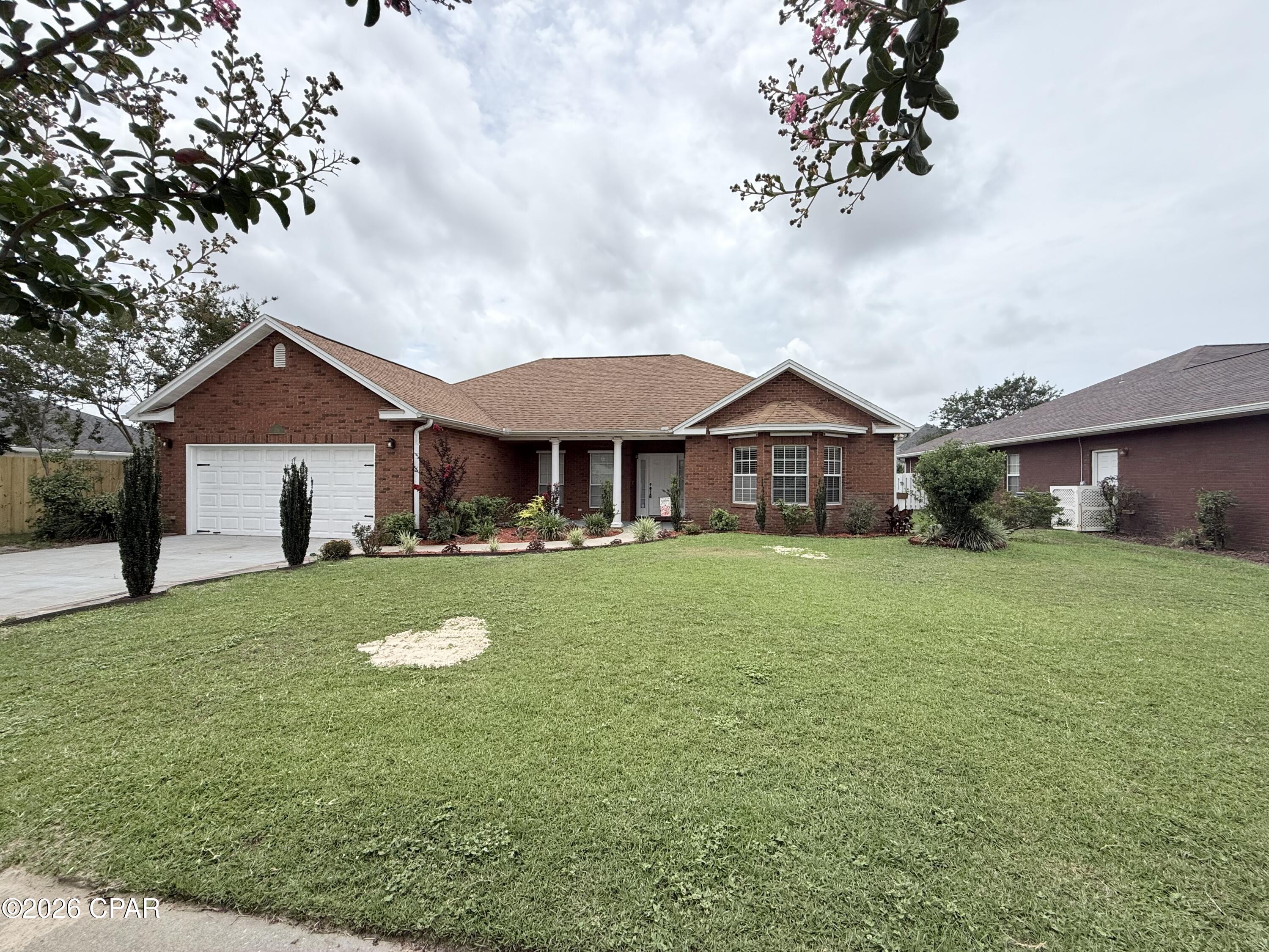 Welcome to this beautiful 4-bedroom, 2-bathroom home located in The Hammocks, one of Lynn Haven's most desirable communities. Offering over 2,000 square feet of living space, this well-maintained home features a spacious split-bedroom floor plan designed for both comfort and functionality.

The inviting living room is highlighted by a cozy gas fireplace, creating the perfect gathering space for family and friends. The well-appointed kitchen features a gas stove, ample cabinetry, and generous counter space, making meal preparation a pleasure. The spacious primary suite provides a private retreat with an en-suite bathroom and abundant closet space.

Residents of The Hammocks enjoy access to a community pool, providing the perfect place to cool off, relax, and enjoy Florida's warm weather without the maintenance of a private pool.

Situated on a large lot in an established neighborhood, this home offers easy access to top-rated schools, shopping, dining, parks, and major employers. Conveniently located near Mosley High School, Publix, Panama City, Tyndall Air Force Base, and the beautiful beaches of Northwest Florida.

Pets are welcome, making this home the perfect place for the entire family. Schedule your showing today and discover everything this exceptional Lynn Haven home has to offer!