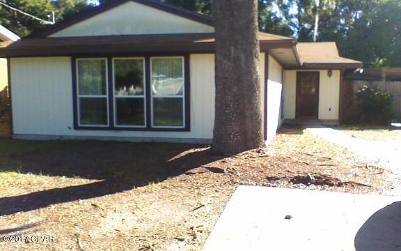 3 bedroom 2 bath home w/covered carport.  This home features new flooring and paint, screened in patio, covered patio and open deck for entertaining and fenced backyard.  This home is close to the Navy Base, Gulf Coast Community/FSU College Campus and Bay. (Natural Gas/Electric)