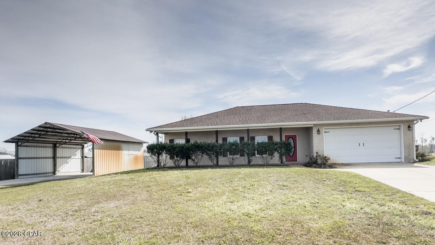 This charming home has all the extras with covered front and rear patios, pole barn, garage, and a huge fenced backyard! A split floorplan and open living space makes the interior feel much bigger, and with custom details like shiplap accent wall, custom pantry door and shelves, and entryway wall detail, you feel at home in the country. 

The primary suite is generously sized, and complete with a walk-in closet with custom shelving. The spacious private bath features dual vanity, a giant beautiful mirror as well as custom décor and shelving to match the country living style. Guest bedrooms have ample room and a spacious guest bath are convenient to both bedrooms and the living area. 

Overlooking the large backyard is your large covered back porch perfect for entertaining, watching the rain, or enjoying some shade in the summer.  A newer privacy fence (2023) has gated access on each side of the home, and there's plenty of room for furry friends, additional storage, or a pool!

A pole barn with separate driveway is perfect for parking your boat, RV, camper, or other toys, or finish and enclose it for additional workshop/garage space! A small well house is handy and keeps your well and water equipment safe and secure. 

Great location for quick access to Highway 231, and Star Ave takes you to Callaway, Parker, and Tyndall Air Force Base. Nearby you'll find 400 acre Majette Park with fishing, disc golf, walking/running track, playgrounds, and more improvements coming (amphitheater, pickleball, basketball, more trails, outdoor fitness, playgrounds- per Bay County Parks Division)

Recent improvements including 2019 Roof, 2023 Gutters, 2023 Well Pump. The front of the property is  an easement with Florida Power & Light, the local electricity utility company. Very handy for additional parking and shared use, it can never be built on and is rarely used by the utility company. 

Schedule your showing today!