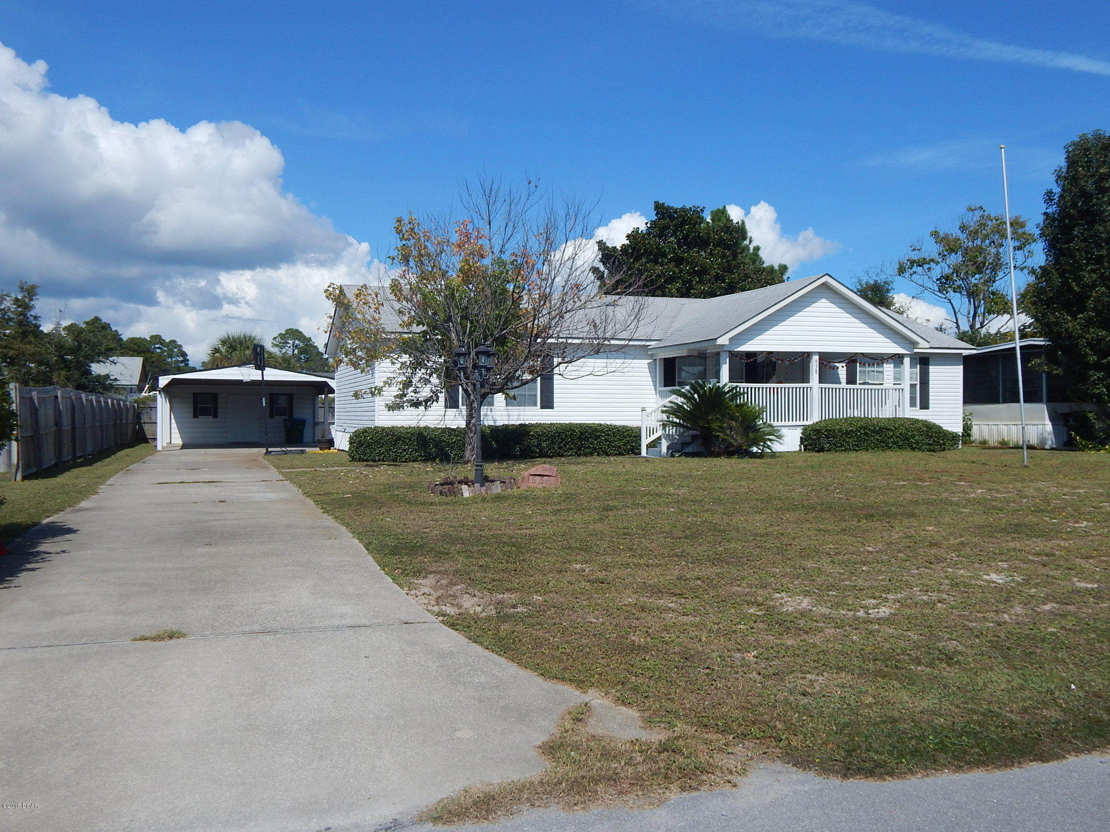 Immaculate home located in the desirable North Lagoon area. Close to Patronis Elementary, Navy Base, shopping, beaches, restaurants. A great floor plan with split bedrooms and bonus room which can be used as a home office or hobby room. Large kitchen and plenty of cabinets. Relax on your covered front porch or work on your insulated workshop carport garage.  This home sits on a large lot with a sprinkler system.