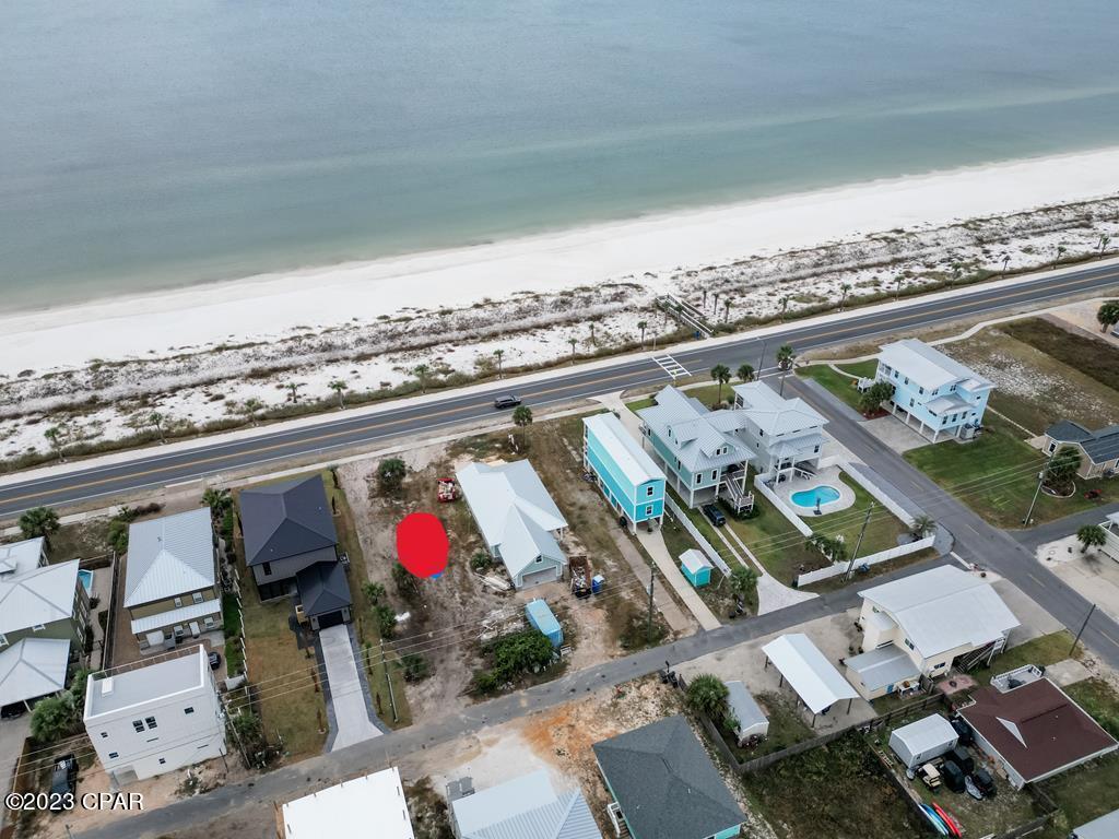 Tucked away in the quaint town of Mexico Beach, Florida, there lies a lot that is the envy of all beachfront property. Situated across from the dedicated beach, this lot boasts an unobstructed view of the glistening ocean and the breathtaking sunsets that paint the sky in hues of orange and pink. The white sand stretches for miles, inviting barefoot strolls and sandcastle-building contests. The sound of dolphins playing in the surf is a common occurrence, and the fishing and swimming are unparalleled. But most of all, it is a place of pure relaxation, where the worries of the world melt away with the gentle rhythm of the waves. Zoned for low-density residential development, this lot is the perfect canvas to build the home of your dreams. A place where family memories are created, where laughter fills the air, and where the connection to nature is unbreakable. The beaches of Mexico Beach are known for being family-friendly, and this lot is no exception. It's a place where children can run free, where parents can unwind, and where grandparents can watch the world go by. So, if you've ever dreamed of owning a piece of paradise, this lot is the perfect place to call your own. Come, build your dream home along the beach and create lasting memories that will be cherished for a lifetime.