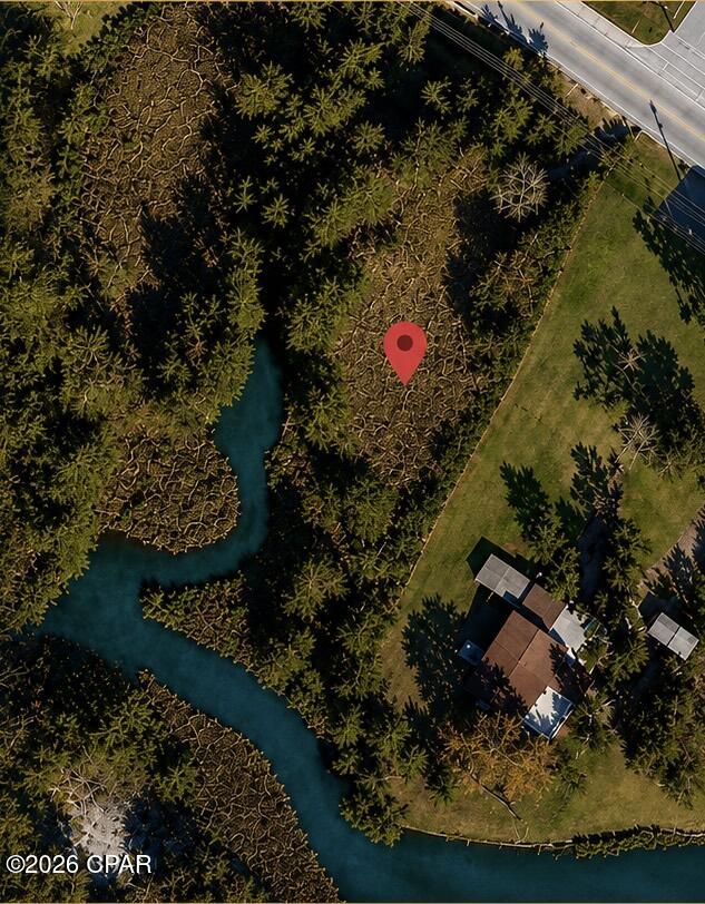 Discover a rare opportunity to own a private waterfront 0.48 acre lot in one of Panama City Beach's most desirable locations. This prime vacant lot offers approximately 20,995.92 square feet and is ideally situated at the end of North Lagoon, providing a unique and secluded setting with endless possibilities for your future home or investment.

The property features waterfront access, public sewer and water, fill dirt already on site, and a boat dock and seawall permit approved, making it an excellent choice for new construction. Enjoy the convenience of being within walking distance to the beach while also being close to shopping, restaurants, and everyday amenities.

Located in an established neighborhood, this large lot offers a peaceful atmosphere while remaining conveniently close to beach access, boating, fishing, paddle boarding, jet skiing, and other popular coastal activities. Whether you're looking to build a custom waterfront residence, a vacation retreat, or an investment property, this exceptional homesite provides the perfect canvas to bring your vision to life.

Note: Owner is also the Listing Agent for 8916 N Lagoon Dr, Panama City Beach, FL 32408