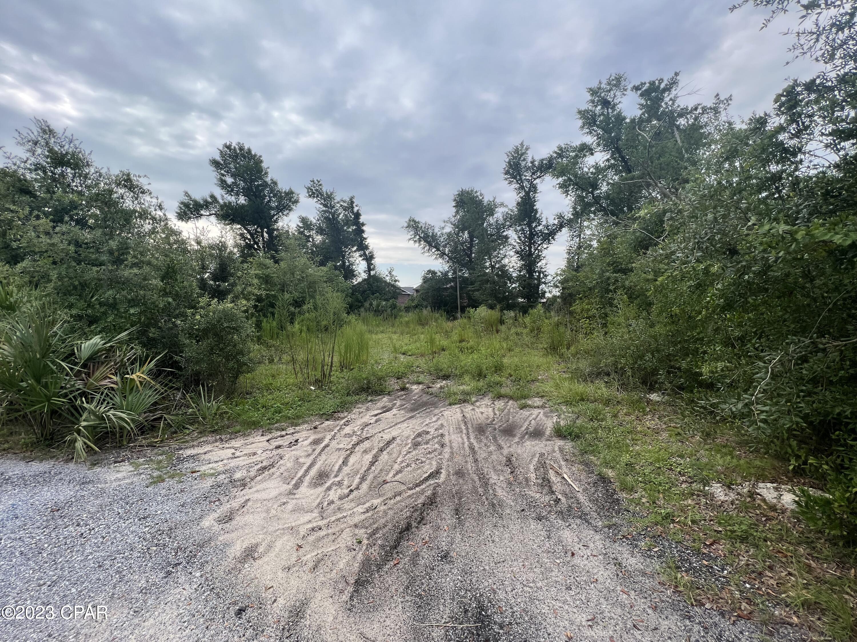Near 1/2 acre vacant lot conveniently located in the heart of highly sought Lynn Haven - it is under the county, not city. Build or bring your new home & enjoy the benefits of a non HOA community! Property has septic tank on site that is a size or so larger than needed for a single trailer - it was used to operate two double wide trailers before Hurricane Michael. Property has also had electricity connected to prior to hurricane.