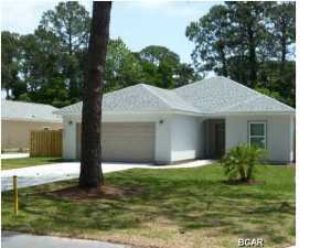 Imagine a 15 year exterior warranty! Hardi Plank siding with baked in color, vinyl windows, stucco with blended color, vinyl soffits and 40 year shingles. This is your opportunity to be in your brand new 3 bedroom 2 bath single story home situated on a 65' x 190' lot located in the heart of Panama City Beach. You are minutes away from the Navy base, shopping, and all the entertainment the beach has to offer. This home features over 1,560 square feet of heated and cooled living space. Enjoy the arched doorways and the bull nosed corners. All of the bedrooms have plush upgraded carpet, all of the other areas have porcelain tile. The master bedroom features a nice oversized walk-in closet. The master bath has double vanities and a large walk in shower. All of the kitchen