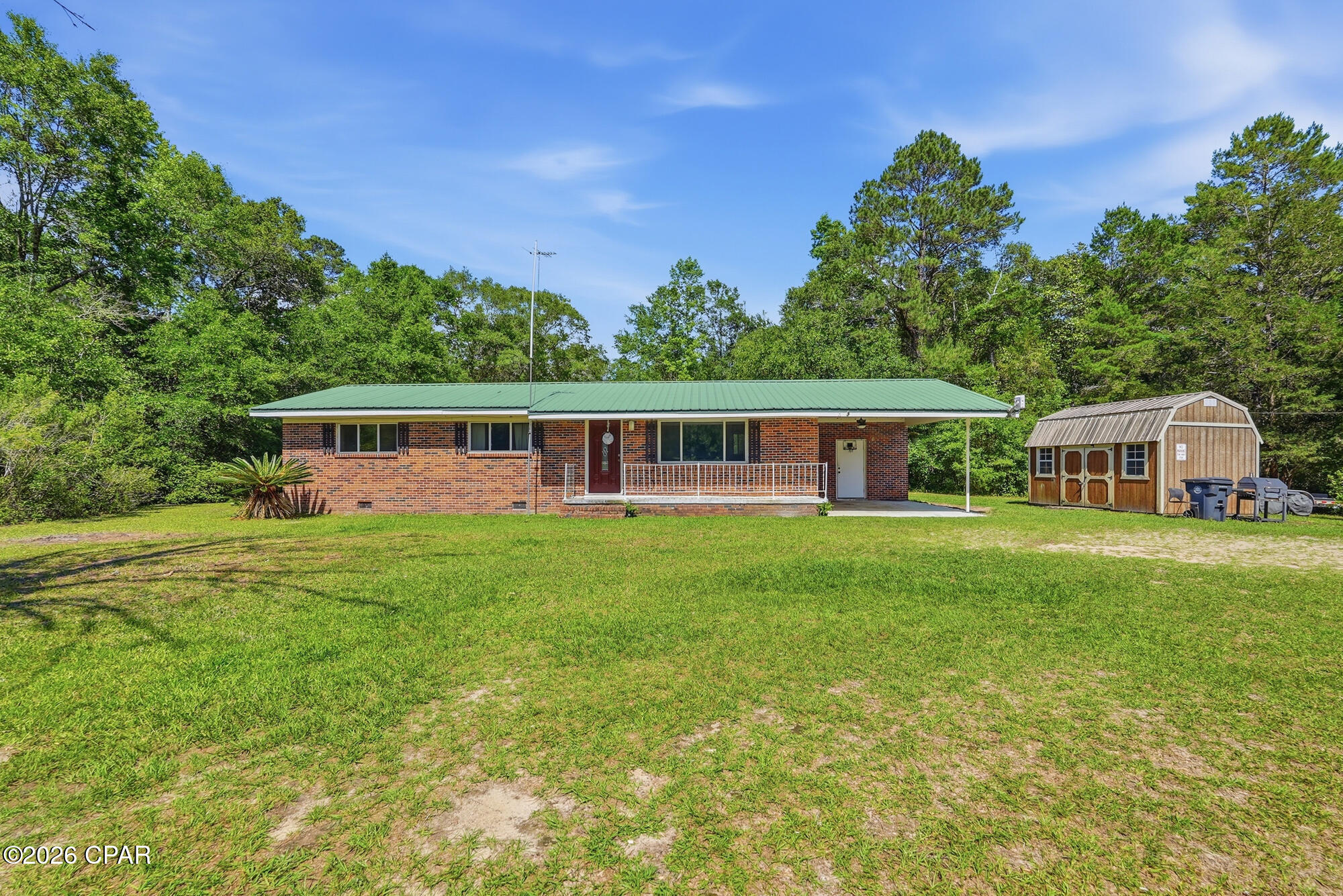 Are you craving peaceful country living without giving up easy access to the beach? Then this home may just be the perfect fit for you! Brick house, metal roof, well maintained with a large shed for extra workspace and sitting on 3 acres of gorgeous greenery!