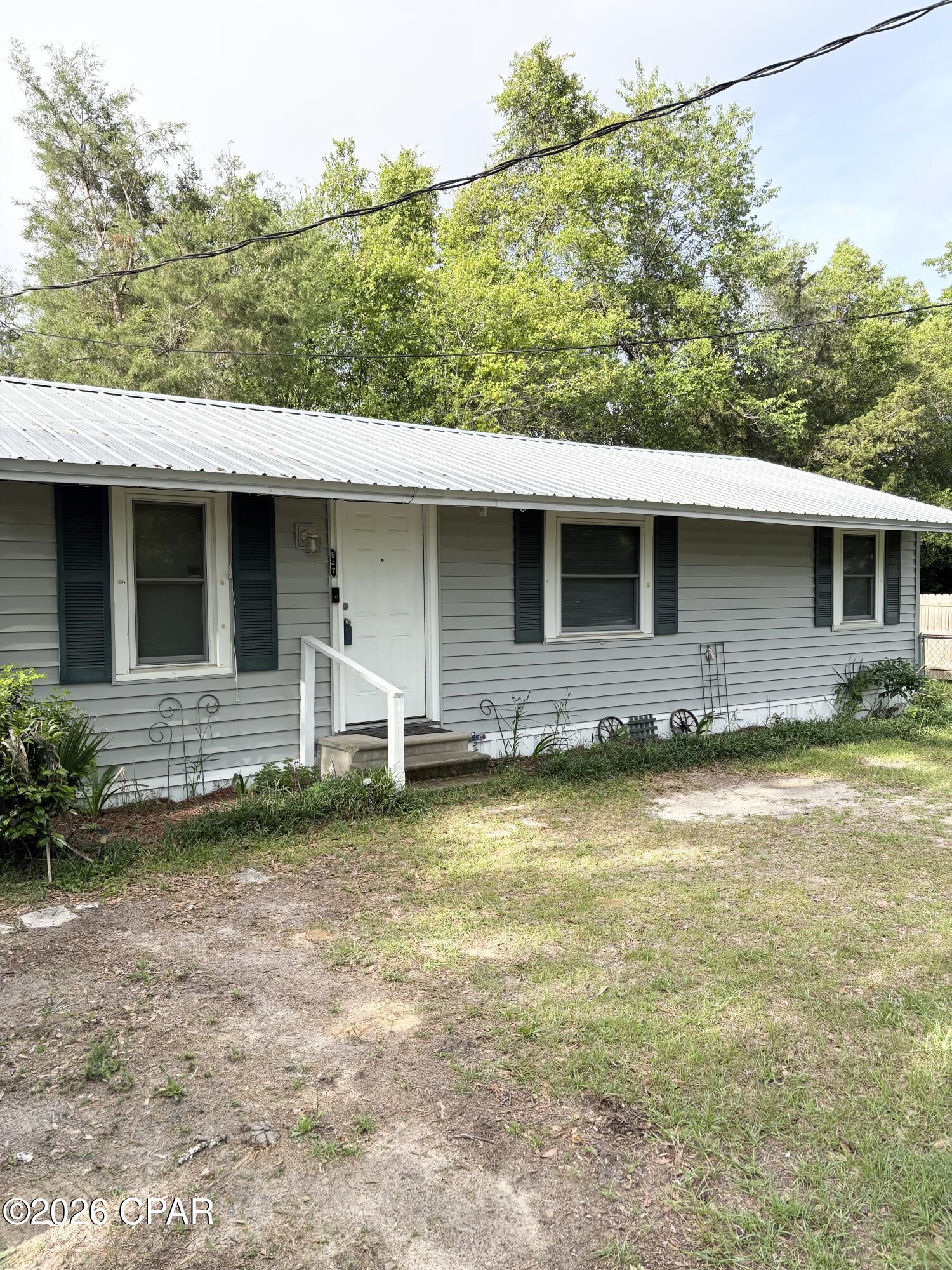 Welcome to this inviting home in the heart of Graceville with a large lot for future development! Offering 3 bedrooms and 1 bathroom, this property combines small town charm with practical updates already in place. Recent improvements include a newer metal roof and an energy efficient mini split system, helping provide comfort and peace of mind for the next owner. The spacious yard gives you plenty of room to enjoy the outdoors, entertain, garden, or explore future possibilities for expansion or development. A recent survey is available showing the separate lot with its own water meter! Properties with this much outdoor space and potential are becoming harder to find. Located just a short distance from local shopping, restaurants, and a nearby coffee shop, you will enjoy the convenience of being close to everything while still enjoying the relaxed feel of Graceville living. Whether you are looking for a place to call home or you are an investor wanting to add to your rental portfolio, this property offers plenty of opportunity and potential. With its convenient location, recent updates, and large lot, this is one you will want to see for yourself. All measurements are approximate and should be verified if important.