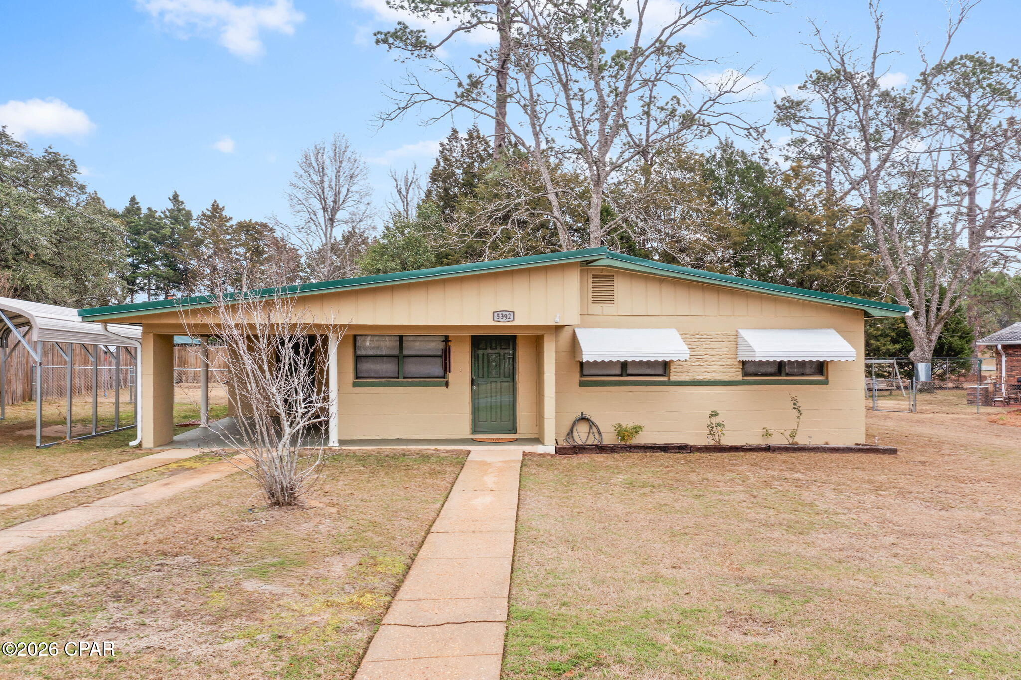 This charming 3 bedroom, 1 bath home offers comfortable living with several recent updates throughout. Inside, you'll find new vinyl plank flooring that adds a fresh, modern touch to the main living areas. The kitchen has been updated and features a functional, efficient layout that makes great use of the space. A versatile bonus room provides flexibility and could easily serve as a dining room, home office, or additional living area. Recent improvements include a new electrical panel, adding peace of mind for the next owner. Outside, the property offers both an attached and detached carport for convenient covered parking. The fenced backyard provides space for pets, play, or outdoor enjoyment, while the storage shed with lean-to offers additional storage for tools, equipment, or hobbies. Located just minutes from The Baptist College of Florida, this home is a great opportunity for a primary residence or investment property.