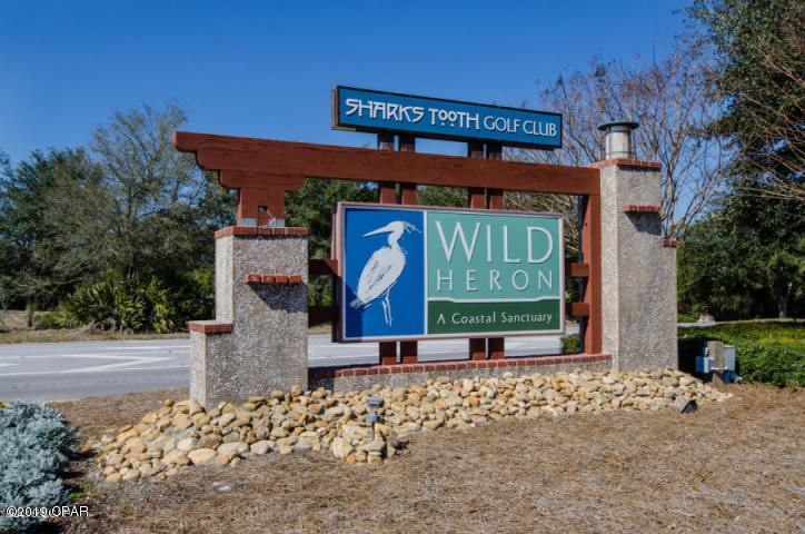 SELLER WILL CONSIDER OWNER FINANCING-- Great lot for building a house in one of the most prestigious, exclusive high end communities in Bay County. A gated, guarded community where amenities abound. Sharks Tooth golf course, tennis courts, swimming pool, club house, fitness room, and so much more. This lot is located at the end of Salamander Rd with natural preserve providing beautiful scenery and privacy. Seller financing terms: Buyer to pay .5% to the St. Joe Foundation at time of closing. Measurements are approximate & should be verified if important.