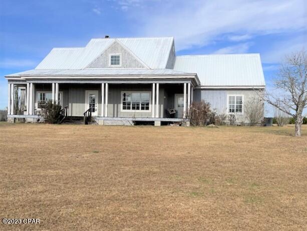Large country home that sits up on a hill.

It has a great design with slit bedroom design.  Two bedrooms have a Jack 'n Jill bathroom.     There is a formal living room with fireplace, a formal dining room and large kitchen with breakfast nook.  The front porch is across entire front with a swing for you to enjoy summer breezes.  There is a large utility shed in back on the property.  With some repairs and updates you will have a great home to enjoy for years.