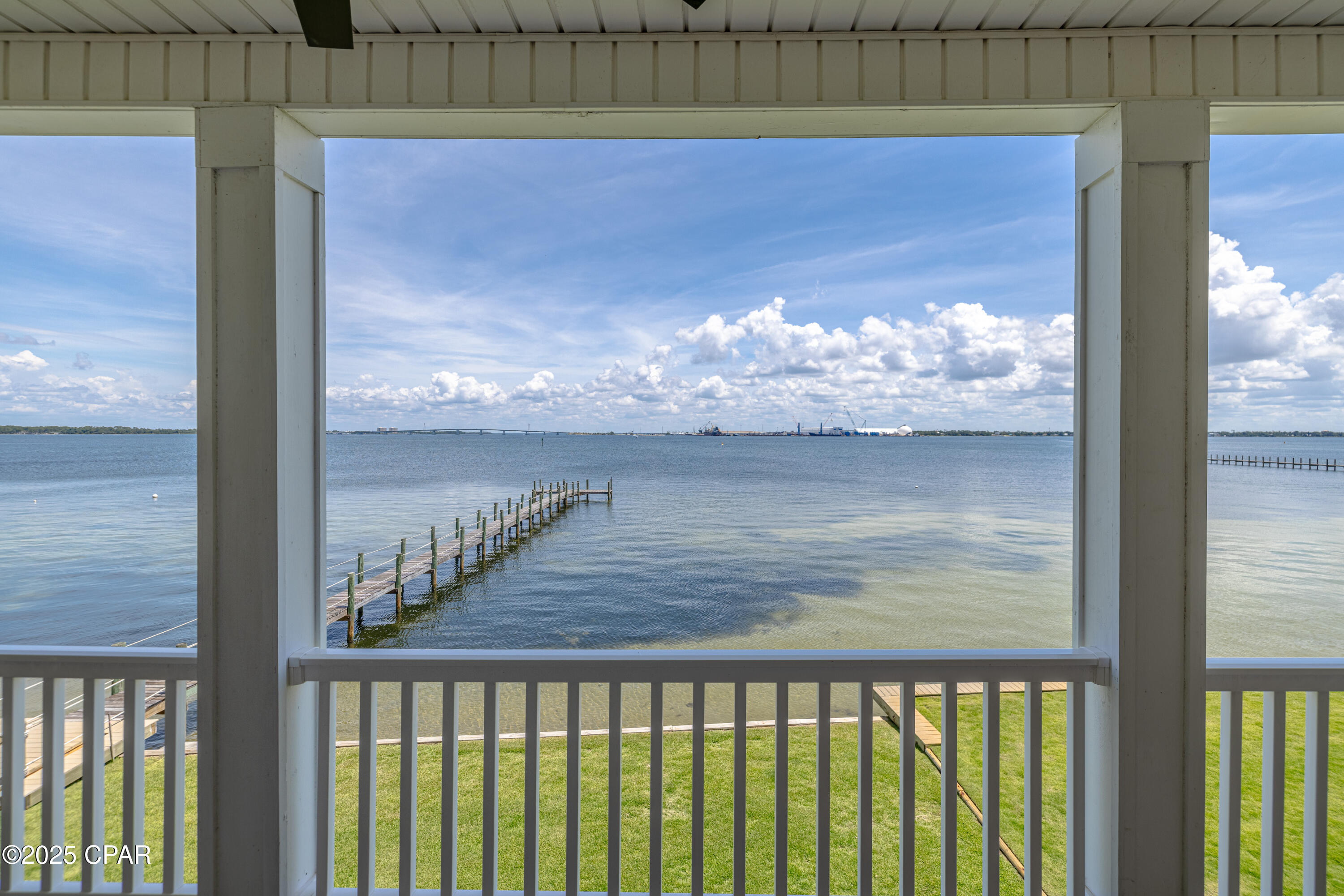 Highly Desirable Rare Opportunity to own this Stunning Waterfront End Unit. 46 Feet on St. Andrews Bay! This home is the Second largest property in the community. The modern kitchen has all upgraded stainless steel appliances well designed soft close cabinets and 2 pantry cabinets which allow for plenty of storage. The Living area includes a wall mounted electric fireplace for Warmth and Beauty. Newly installed 72'' modern ceiling fan. Modern light fixtures. Sprayed insulation in roof provides lower power cost.  Gorgeous views of the Bay from the living area and kitchen. Crown molding and plantation shutters add character and charm.  This spacious home includes 3 Ensuites. The Master bedroom includes a large walk in closet, Master Bath with Soaking Tub, private tiled shower and separate Toilet Room. Double vanity. Private Balcony showcasing gorgeous views of St. Andrews Bay. Second bedroom is spacious and cozy with an attached bath. Jacuzzi tub with double vanity and shower. Private Balcony. Third bedroom has a spacious cozy room with double closet, private bath with tub and shower. Private balcony. The spacious 2 car garage can be conveniently accessed from the 1st floor Foyer. New Sod has been planted along with new pavers for the walkway, steps and drive.  This Prestigious Community includes a Beautiful pool, Hot tub and clubhouse overlooking the bay. The Nature Walk is located on a 7 acre preserve. There are also several docks in the community for boating, fishing and kayaking right from your backyard. Don't miss this opportunity to see this beautiful piece of paradise...~MOTIVATED SELLER!