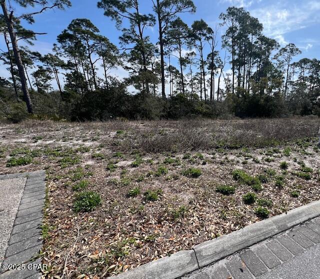Perfect lot near the beach and surrounded by the coastal community of Windmark Beach. This lot measures 85.38' street frontage x 115' deep. Plenty of room for your beach home on this .23 Acre lot. Travel one of the many board walks thru the community and to the beach. There is also a bike and jogging trail along the old Hwy 98 near the beach for miles of adventure. Windmark is a golf cart friendly community, with a small downtown featuring restaurants, music venue, gym, fishing/outdoors store, ice cream shop. Some ammenities at Windmark are community pool, bike/jogging trail, biking, kayaking, fishing, beach, shelling & walking the many boardwalks and trails. This area is truly a slice of ''Old Florida''. What are you waiting for!!