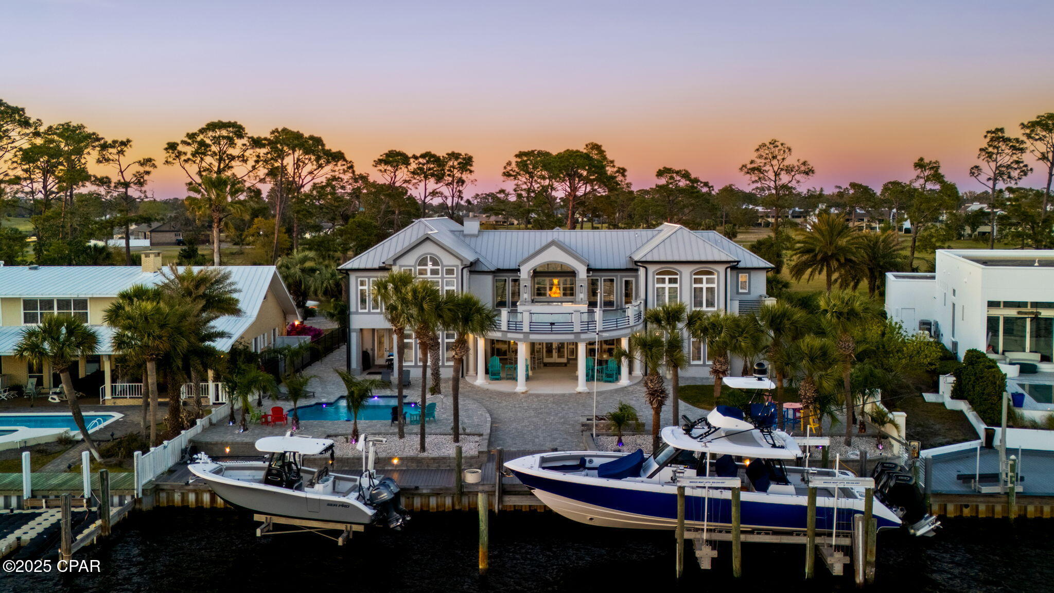Exquisite Bayfront Estate in Bay Point, Florida

Experience the pinnacle of waterfront luxury in this breathtaking five-bedroom, seven-bathroom estate, perfectly positioned on the bay in the exclusive Bay Point community. With unparalleled deep-water access, this home is a boater's dream, featuring both a 40,000-pound and a 17,000-pound boat lift, allowing you to dock your yachts and watercraft with ease. Located just moments from Pointsouth Marina, this property offers direct access to the Gulf of Mexico, making it ideal for the avid mariner.

Step inside to discover a stunningly designed residence that seamlessly blends coastal elegance with modern sophistication. Walls of glass showcase panoramic bay views, filling the expansive living spaces with natural light. The chef's kitchen is an entertainer's delight, boasting top-of-the-line appliances, custom cabinetry, and a spacious island for hosting family and friends. Featuring two master suites with amazing bathrooms and spacious closets and three additional suites, all with custom baths and private balconies, there is plenty of room for the entire family and your guests. Multiple gorgeous bars, a home movie theater, a game room, and a stunning kitchen are just a few of the highlights. 

Indulge in resort-style living with the brand-new heated saltwater pool, perfectly designed for year-round relaxation while overlooking the shimmering bay. 

This estate is more than a home—it's a lifestyle. Whether you're setting sail from your private dock, entertaining in the grand living spaces, or unwinding by the waterfront pool, every moment here is pure luxury. Don't miss the opportunity to own this extraordinary Bay Point masterpiece. OWNER FINANCING may be possible. 

Contact us today for a private showing!