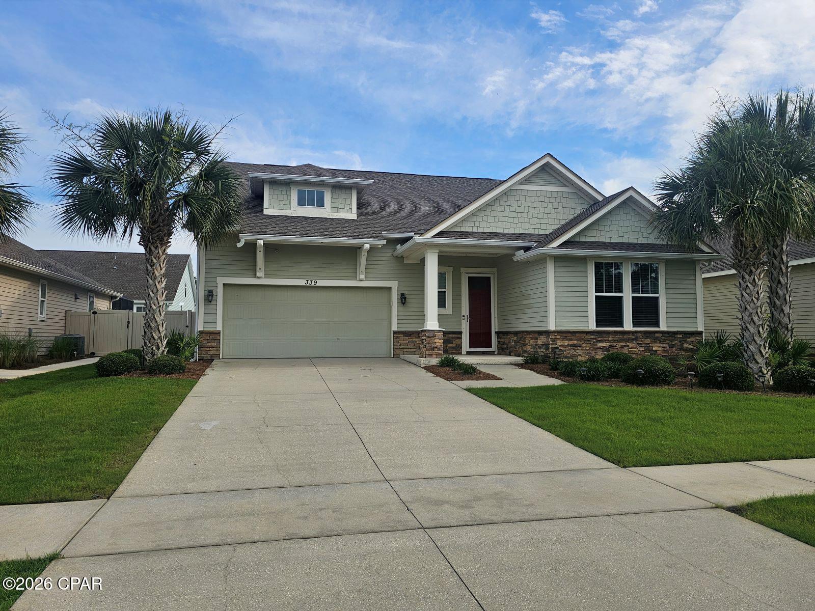 RELOCATED SELLER IS HIGHLY MOTIVATED AND READY TO MAKE A GREAT DEAL. Generous incentives include $5,000 for new appliances plus $10,000 towards Buyer's closing costs.  The home has just been freshly painted and features new flooring throughout.   Welcome to Whisper Dunes, Panama City Beaches beautiful neighborhood on the west end.  339 Blue Sage Road is a 5 bedroom, 3 bath home that looks and feels  like a brand new home.   Everyone is looking for that open floor plan and this one doesn't disappoint.    The feel of the home is a craftsman style  with shaker style cabinets and granite counter tops along with stylish crown molding throughout.  the kitchen features a huge island and a generous stainless steel appliance package.   The living room is open to the kitchen for the spacious feel that you expect from a home built for entertaining.   A luxurious master suite features dual vanities, walk in shower, separate soaking tub and large walk in closet.  All of the remaining bedrooms are very large and perfect for those needing the extra space.  The exterior of the home is built to last with hardie board style siding and stone accents.   If you have been looking for great beach living in a private community, close to the water and 30A, this is the ONE. Call today