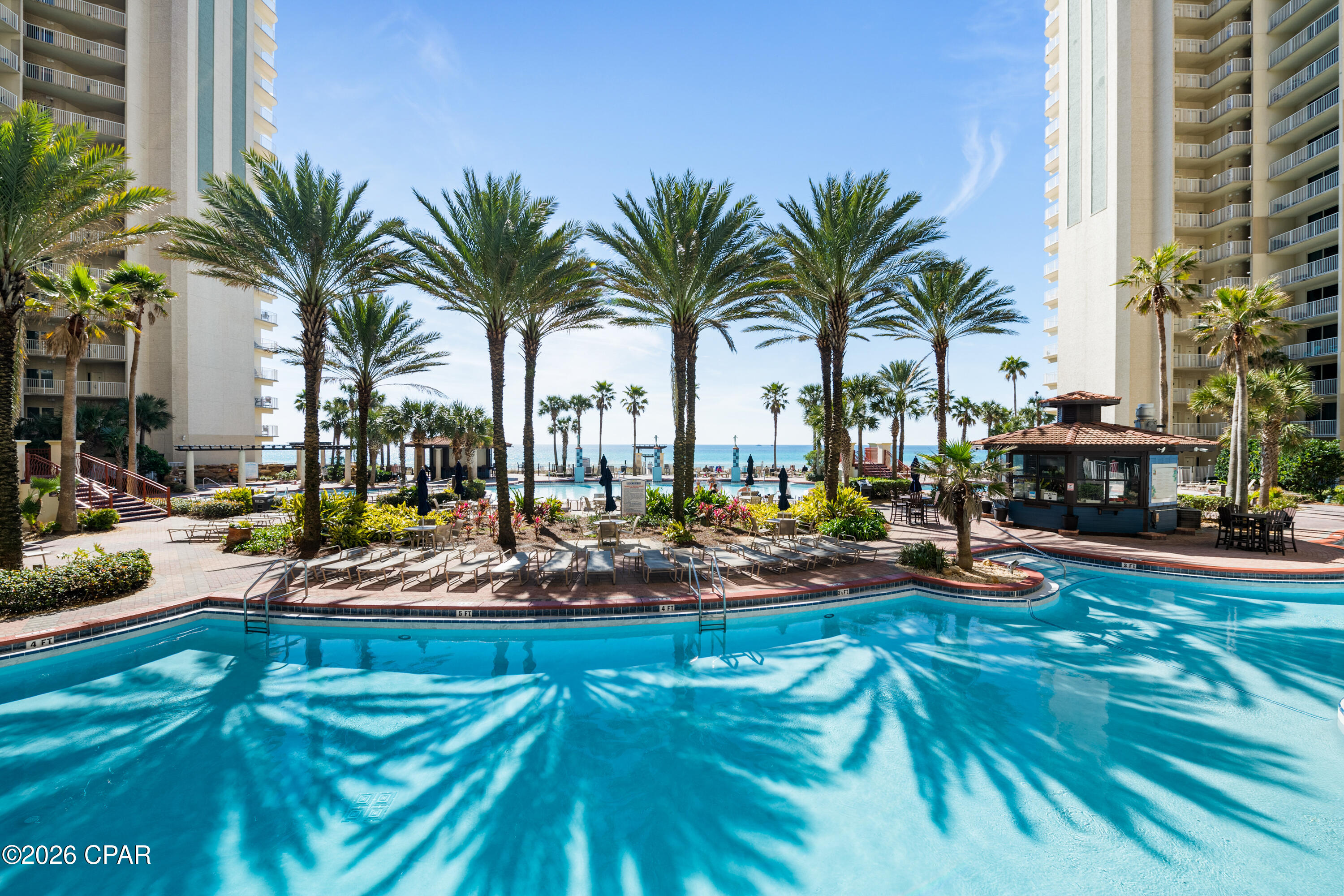 WELCOME TO SHORES OF PANAMA 1704.....Stunning beachfront residence at **Shores of Panama - Unit 1704**. This beautifully appointed 2-bedroom plus private bunk room condominium offers exceptional Gulf views, luxury finishes, and impressive short-term rental potential. With the right management company, projected gross rental income ranges from **$75,000-$80,000 annually**, making it an outstanding investment opportunity.

## Property Overview

Unit 1704 is thoughtfully designed for comfort, privacy, and rental performance.

- **2 oversized bedrooms**, each featuring a private ensuite full bathroom  
- **Private bunk room** with its own bathroom and stand-up shower  
- Spacious open-concept living and dining area  
- Expansive beachfront balcony with breathtaking Gulf views  
- Offered **fully furnished** with upscale décor  
- Well-equipped kitchen with quality cabinetry, appliances, and ample counter space  

The split-bedroom layout maximizes privacy for guests, making this unit highly desirable for vacation rentals. The additional bunk room with a private bath significantly enhances occupancy potential and guest appeal.

## Investment Highlights

This property is approved for **short-term rentals** and has strong income potential.

- Estimated **$75,000-$80,000 gross annual income** with professional management  
- High-demand beachfront location  
- Turnkey and rental-ready  
- Strong guest appeal due to layout and amenities  

With its prime Gulf-front positioning and resort-level amenities, Unit 1704 is designed to generate consistent rental performance while offering owners personal enjoyment.

## Resort-Style Amenities at Shores of Panama

Shores of Panama is known for delivering one of the most impressive amenity packages on the Gulf Coast.

- **13,966 sq. ft. Gulf-front, zero-entry lagoon-style pool** with hot tub  
- Heated indoor pool for year-round enjoyment  
- Two seasonal tiki bars serving lunch and dinner  
- On-site coffee shop  
- Fully equipped fitness center  
- 24/7 on-site security  
- Direct beach access  

The lagoon-style pool is a signature feature of the resort and a major draw for vacationers.

## Prime Location

Convenience and entertainment are right outside your door.

- Adjacent to **Pineapple Willy's**, a local favorite  
- Walking distance to numerous restaurants, shopping, and entertainment venues  
- Wal-Mart located directly across the street for everyday essentials  

This central location enhances rental desirability by offering guests easy access to everything they need without requiring transportation.

---

Shores of Panama Unit 1704 delivers the perfect combination of luxury beachfront living and strong investment potential. Whether you are seeking a high-performing vacation rental or a personal Gulf-front retreat, this fully furnished, amenity-rich residence is positioned to exceed expectations.