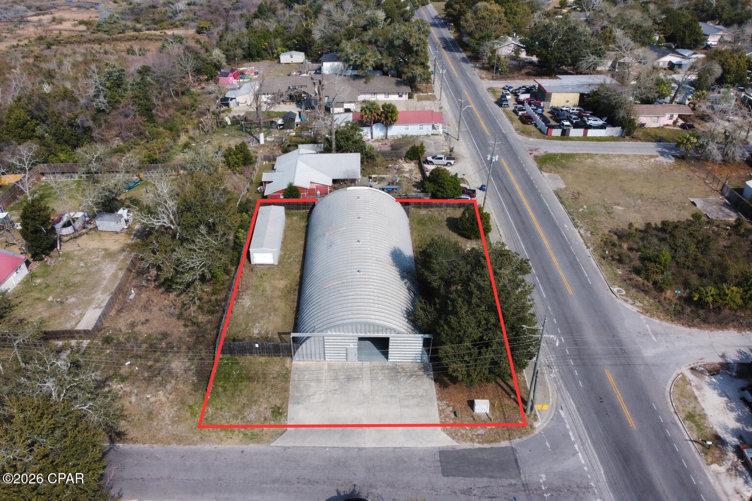 Exceptional opportunity to acquire a 5,000± square foot, climate-controlled commercial building designed for high-function , commercial, automotive, fabrication, woodworking, warehouse, and storage uses. This Quonset-style steel structure offers durable construction, modern mechanical systems, and flexible interior layout--ideal for owner-users or investors seeking a versatile commercial asset.
5,000± SF Climate-Controlled Interior
3-Phase Power - suitable for heavy equipment, machinery, and commercial operations. Spray Foam Insulation (walls & roof) for energy efficiency and temperature stability
Epoxy-Coated Concrete Floors - durable, clean, and chemical-resistant
14' Front Sliding Door providing excellent access for vehicles, equipment, and deliveries
Upgraded LED Lighting throughout for bright, efficient workspace
Commercial HVAC System designed for full-building climate control
Interior Improvements included are 
Dedicated Office Area - ideal for administrative or customer-facing operations, Kitchenette with cabinetry and workspace. 
Ample Storage Areas supporting operational efficiency, flexible open-span layout allowing for reconfiguration based on need. This property supports a wide range of commercial applications, including but not limited to: Cabinetry & woodworking shop
Automotive service or specialty fabrication,
Warehouse & distribution, Contractor operations, Equipment storage, Light manufacturing or assembly. Mixed office Construction & Systems Highlights include
Steel arch / Quonset-style construction, Concrete slab foundation suitable for commercial loads, Modern electrical infrastructure with industrial capacity, Energy-efficient insulation and lighting systems. Investment & Owner-User Appeal include a Functional, move-in-ready industrial space, High utility with minimal layout constraints, Strong long-term durability and low maintenance construction and Suitable for both owner-occupants and income-producing strategies. The 12± Ft. x 40± Ft. portable building can be purchased separately. This property delivers rare versatility, industrial-grade power, and modern interior improvements in a compact, efficient footprint. Ideal for businesses seeking a clean, climate-controlled, and adaptable commercial facility in the Panama City market.