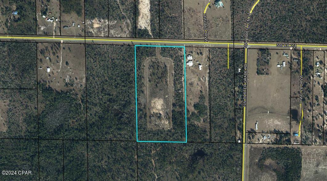 Builders looking to start up a subdivision?  This land has had the work started.  Engineered road, ditches, culverts.  Years ago rock road put in and lots platted on paper.  Zoned Residential.  Road now must be paved. Gated entrance.  If not looking to develop and want to build right in the middle, this is it.  Scattered oak & pine trees and level land.  Located on a paved road.  45 minutes MOL to Panama City to beaches. Turn this into your own personal oasis.
