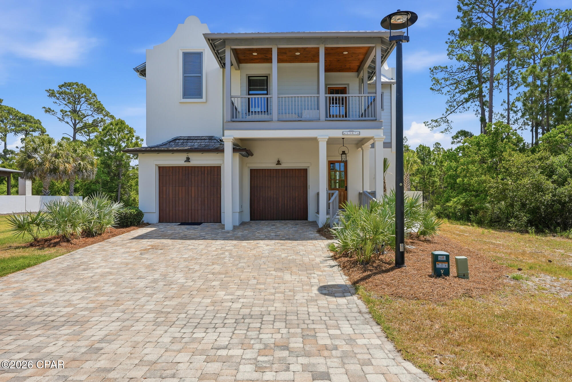 ***CURRENTLY UNDER CONTRACT. SELLER WILL CONSIDER BACK UP OFFERS. 3 BEDROOM(WITH HOME OFFICE), 2.5 BATHROOM STUNNING HOME IN THE EXCLUSIVE(AND GATED) MARTINIQUE COMMUNITY!!!*** This absolutely breathtaking 6 year old home has been meticulously maintained by its owners. Exterior features include but are not limited to: Metal roof with cedar shake accents, a brick pavers driveway, first floor stucco walls with stucco parapets and second floor hardie board siding, custom cypress wood garage door, tankless gas water heater, wood deck, tongue and groove front porch ceiling with pecky cypress and tile floors. The screened porch is absolutely beautiful and perfect for relaxing in, and to top it ALL off a $55,000 backyard renovation finalized in 2024 that includes a stucco concrete wall, brick pavers, wood gates and artificial turf. As you step inside the home you are greeted to an open floor concept that offers crown molding, ceiling fans throughout the home and bedrooms, a wood look tile throughout the first floor, wood stairway, spacious loft, second floor luxury vinyl plank flooring, tiled master bathroom with a marble band and marble shower floor, marble tiled guest and half bathrooms and custom closets in all rooms. The living room shell stucco gas fireplace(with a gas ventless insert)is an added touch, perfect for those cool winter nights. Kitchen comes with stainless steel appliances, a gas range, custom pantry, shaker style cabinetry, quartz countertops(throughout home), and a marble backsplash. Spray foam insulation and impact resistant windows throughout. This home will not last long...so call me before it gets away! All information is approximate and should be verified by buyers if important.
