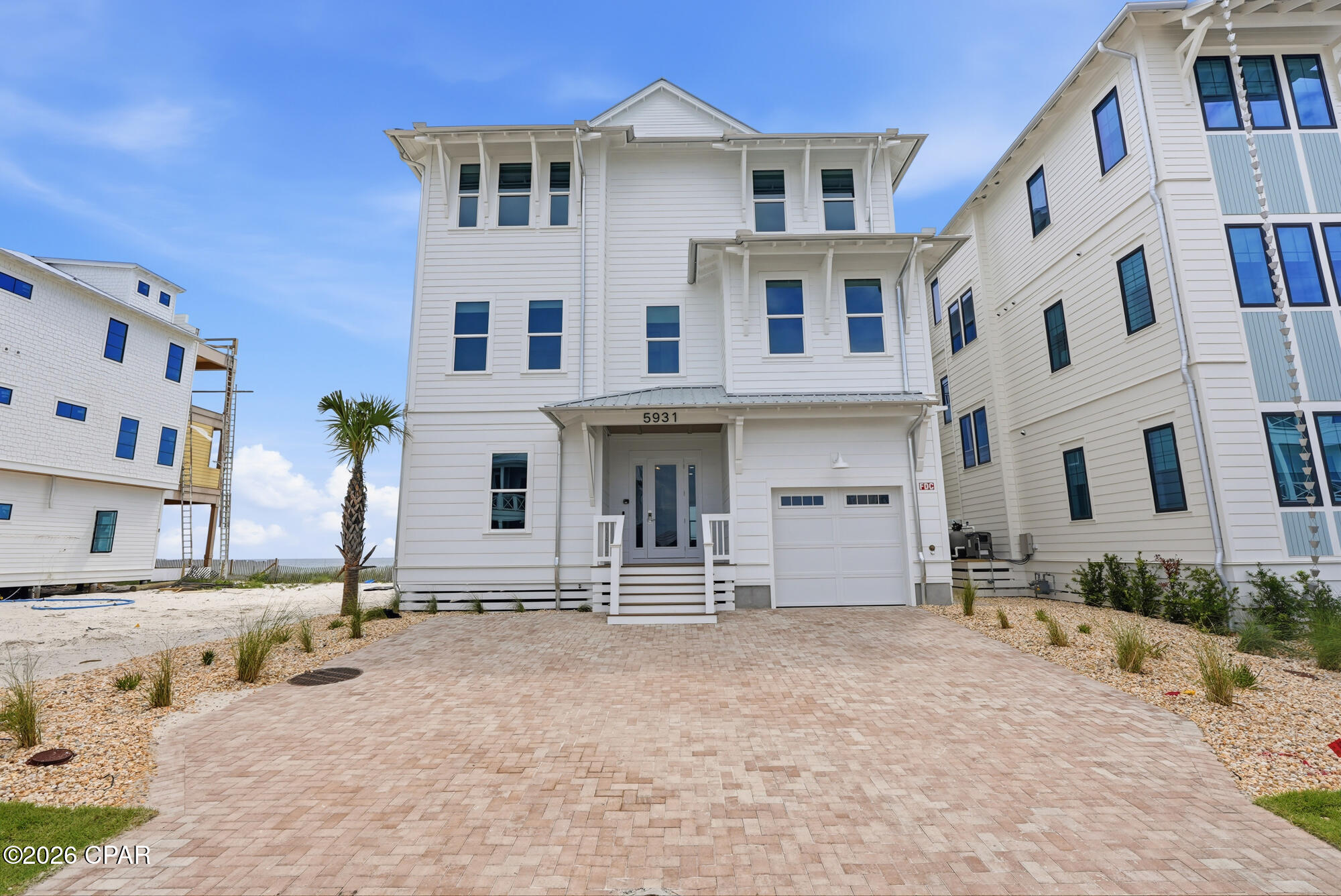 There is something timeless about waking to the sight of the Gulf stretching endlessly beyond your window. At 5931 Gulf Drive, that experience becomes part of everyday life. Positioned directly on the shoreline within Hadley's Beach, an intimate community where only ten residences enjoy true Gulf-front placement, this fully furnished home invites you to live at the water's edge, where the rhythm of the waves sets the pace of the day.

Spanning 5,031 square feet, the residence was designed around the view. From the moment you enter, the Gulf commands attention--an ever-changing backdrop of turquoise water, white sand, and expansive coastal sky. Sunlight moves effortlessly through the home's generous living spaces, creating an atmosphere that feels both elevated and welcoming.

The heart of the home is where people naturally gather. A beautifully appointed kitchen with premium appliances opens seamlessly into the living and dining areas, creating a setting equally suited for celebratory dinners, holiday gatherings, or quiet mornings with coffee overlooking the shoreline. Every space feels connected, designed to bring family and friends together while never losing sight of the water beyond. With seven bedrooms and eight-and-a-half bathrooms, the home offers room to spread out and settle in. Yet it is the third-floor primary suite that truly captures the imagination. Elevated above the coastline, it feels almost suspended between sea and sky. Here, sweeping Gulf views greet the morning, while evenings are framed by breathtaking sunsets reflected across the water.

Outside, life naturally gravitates toward the Gulf. A private pool offers a refreshing retreat between beach walks, while the shoreline itself is just steps away. Days begin with sunrise strolls along the sugar-white sand and end with conversations carried by the sound of the surf. Thoughtful additions such as two laundry rooms and an elevator servicing all levels bring comfort and convenience to everyday living.

Offered fully furnished and with short-term rentals permitted, the home is prepared to be enjoyed from the moment you arrive. Whether envisioned as a gathering place for generations, a coastal retreat, or an investment in one of Panama City Beach's most desirable beachfront communities, the experience remains the same: effortless, refined, and deeply connected to the beauty of the Gulf.

At 5931 Gulf Drive, the shoreline is not simply a view--it becomes part of the way you live.