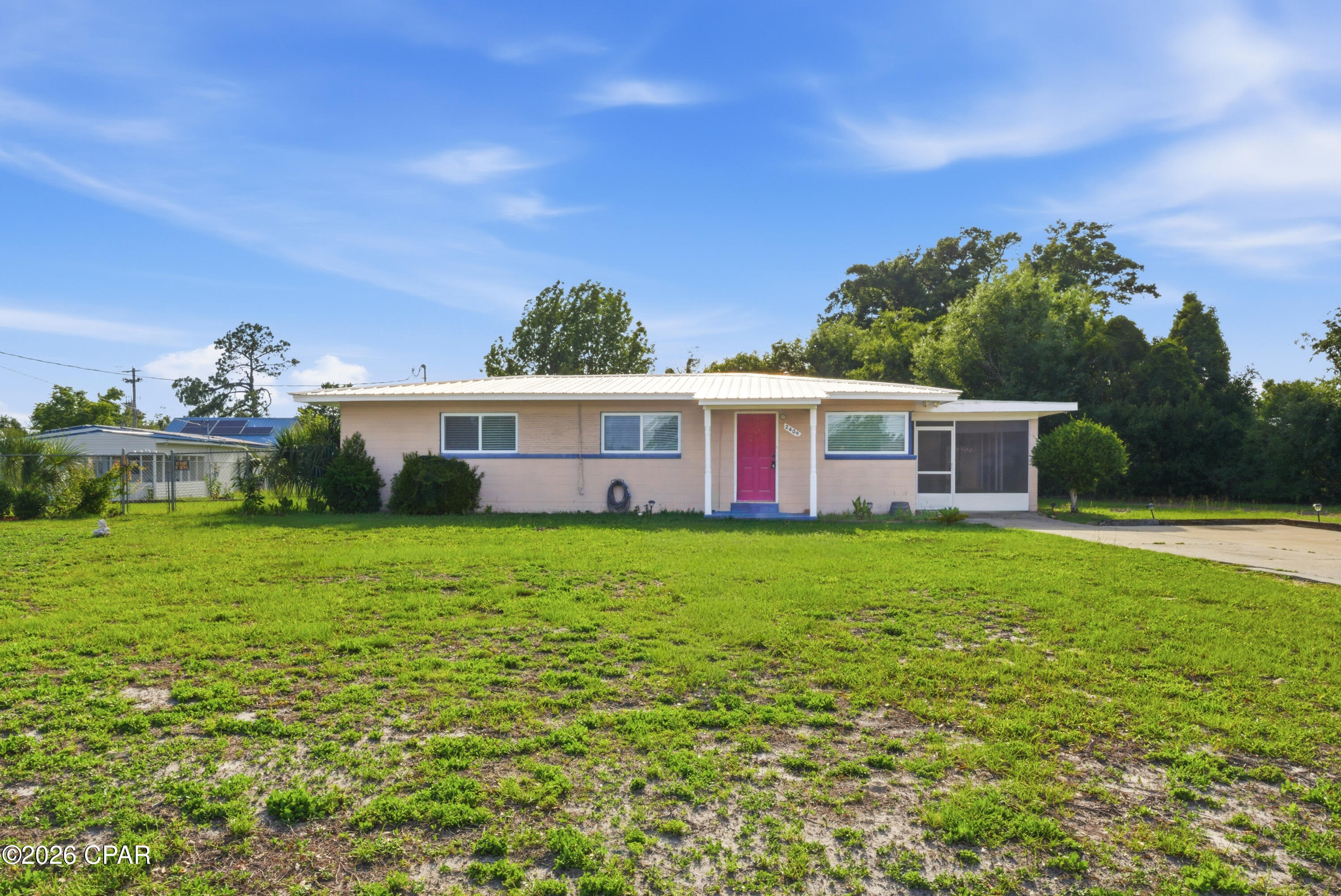 Fresh, clean, and move-in ready in the heart of Panama City! This updated home offers bright open living spaces, tile flooring throughout, and a functional layout designed for everyday comfort. The kitchen features granite countertops, white cabinetry, stainless refrigerator and white stove, and plenty of workspace for cooking and entertaining. Spacious bedrooms and updated bathroom gives the home a modern feel while maintaining a warm and comfortable atmosphere.

Step outside to a large screened patio overlooking the oversized backyard with room for pets, play, gardening, or future outdoor additions. A detached garage/workshop adds extra storage and flexibility for hobbies, tools, or recreational equipment.

Conveniently located near schools, shopping, dining, parks, and just a short drive to the beaches, this property offers the perfect mix of space, functionality, and location. Whether you're searching for a primary residence, first home, or investment opportunity, this property is ready for its next chapter.