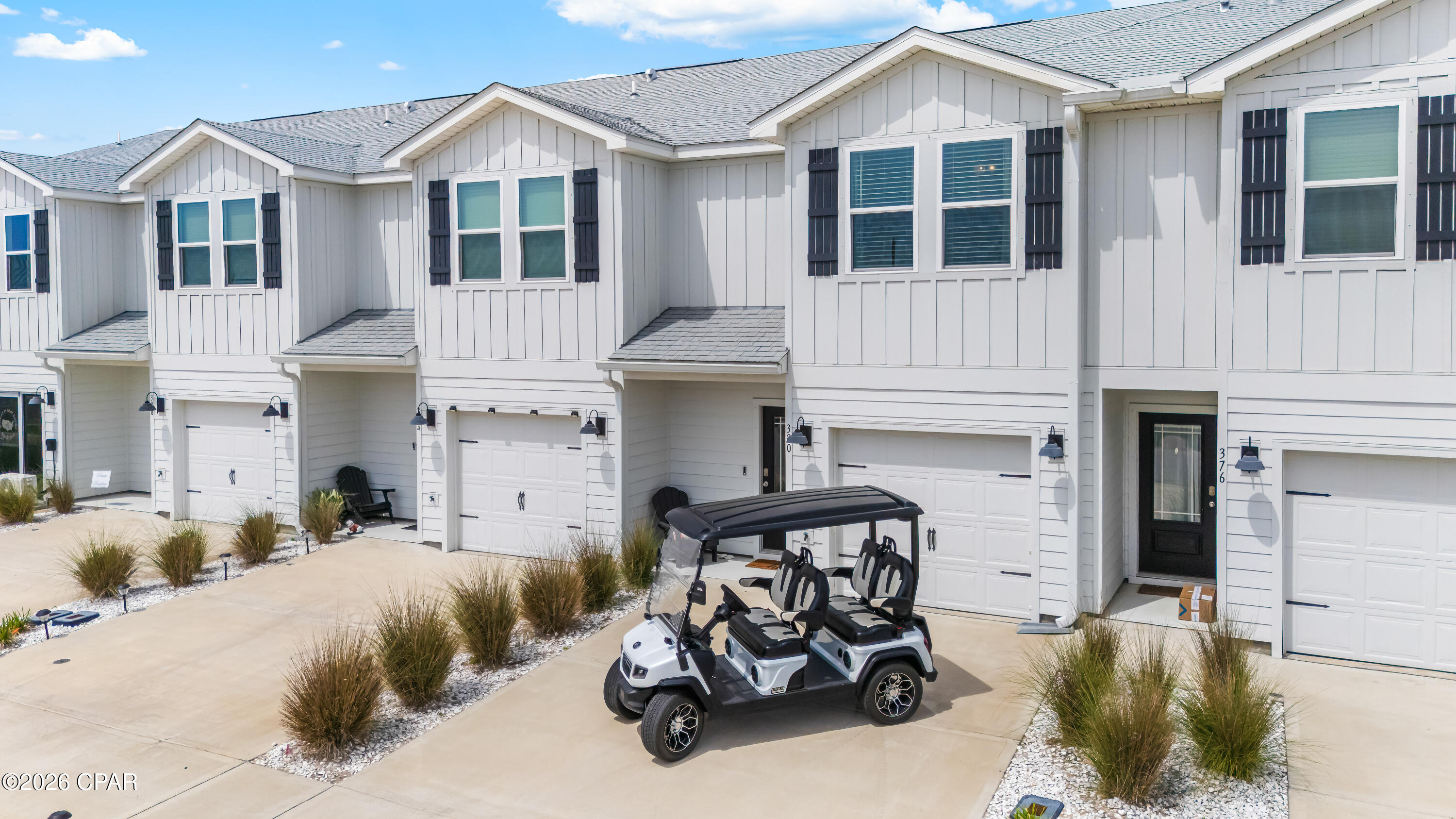 Experience easy coastal living at 380 Salt Creek Ln in Mexico Beach. Located in the new Salt Creek townhome community, this 3-bedroom, 2.5-bath townhome offers distant Gulf views, modern finishes, and a turnkey setup. Sold fully furnished including golf cart, this property is ready for you to enjoy from day one. The open-concept layout features luxury EVP flooring, quartz countertops, stainless steel appliances, white cabinetry with brushed nickel hardware, and a spacious living area designed for gathering after a day on the water. Located within a half mile of Mexico Beach's beautiful white sand beaches, this property is ideal as a primary residence or second-home beach getaway. Priced to sell with furnishings and golf cart included, this is an easy opportunity to start enjoying the Mexico Beach lifestyle.