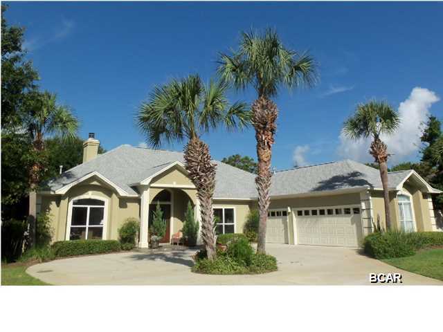 REDUCED! Situated on one of Bay Point's largest and most appealing golf course lots, rarely will you find a truly magnificent setting such as this. Driving down the long driveway to this meticulously maintained home, you will find over 3000 square feet of custom design. Beautiful dramatic front doors as you enter the foyer you walk into the living room to enjoy the most beautiful open view all glass doors looking onto the screened porch, inviting swimming pool and green grass as far as you can see. There is fresh paint throughout the home and large open living room. You will find 4 Bedrooms, 3 Baths and a large living room with a gas fireplace with a split bedroom floor plan. This home has a great kitchen with breakfast bar and was renovated with new appliances and granite countertops. There is a breakfast area overlooking the back yard and swimming pool and a custom desk with built-in shelves for a work station for your computer. The fourth bedroom can also be used as an office separate dining room, very large master suite (20X19) with large master bath with double vanities and his and her closets. This home also has hardwood, carpet and sandstone and quartzite flooring imported from India. Enjoy afternoons on your screened in porch with retractable awnings. The in-ground pool is surrounded by a fenced in yard and the lot is situated overlooking the 14th fairway of the Jack Nicklaus golf course. There is a large workshop with separate A/C, an outdoor shower for your quick convenience, and a three car garage. The lush massive front and back yard has been beautifully landscaped. Embrace the Florida life style you have dreamed about while living in a lovely gated community offering privacy and 24 hour security. Age, SF, lot and room sizes are approximate. Please verify if important.