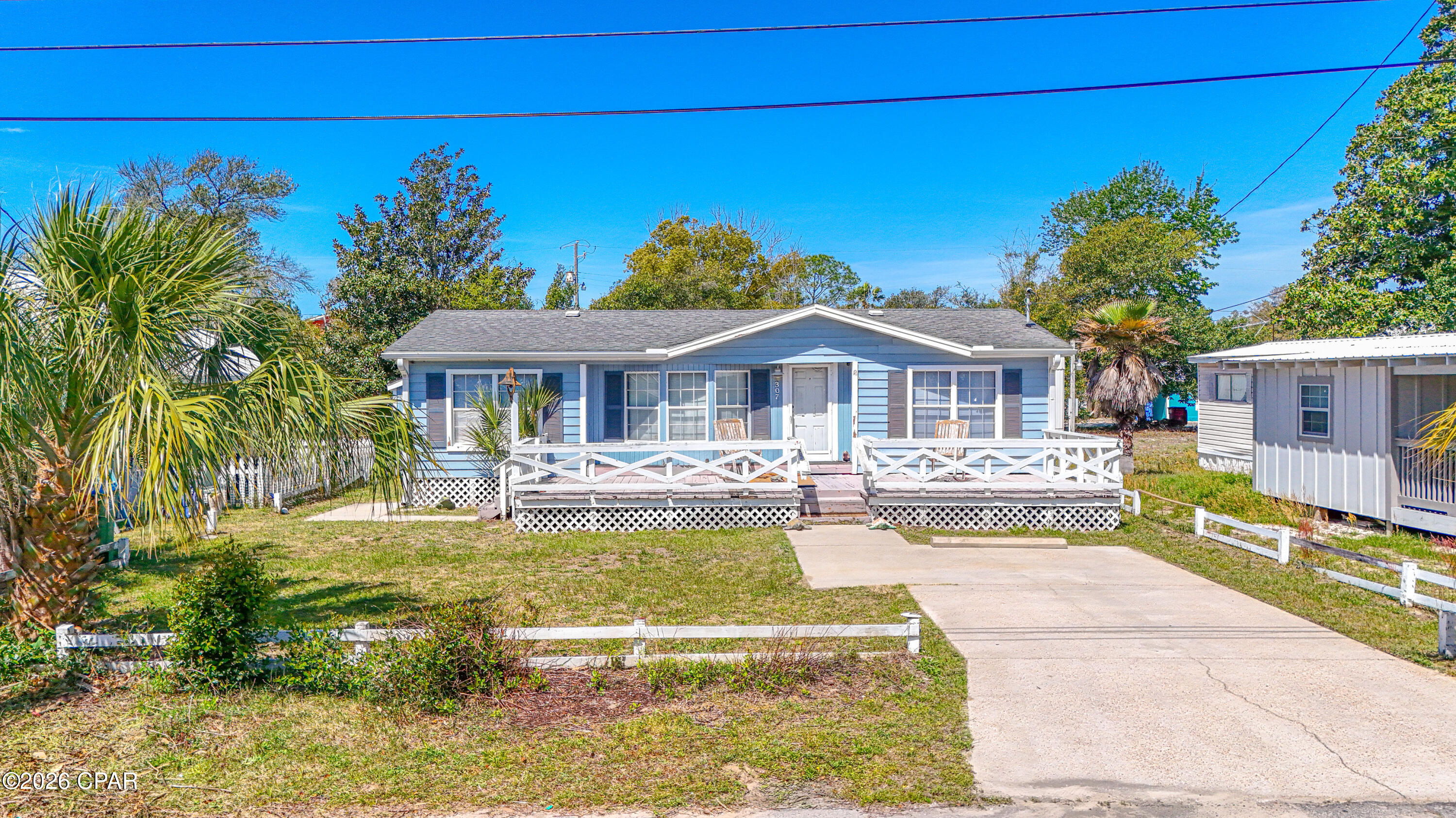 NO HOA! 2 MINUTE WALK TO BEACH! Seller will rebate $10,400 at closing with a full price offer towards the repair estimates obtained towards repairing the soffits, wood rot and new piping for plumbing.  

Positioned in Laguna Beach on the west end of Panama City Beach!  This is one of the most pleasant, walkable, and golf cart-friendly beach neighborhoods along the Emerald Coast.  Not far from Pier Park and you're also approximately a 6-minute drive to Scenic Highway 30A, including Rosemary Beach, Alys Beach, Inlet Beach, and Seaside.

Laguna Beach (a dedicated beach) offers a charming coastal cottage neighborhood feel with walkable streets, natural dunes, and no high-rise development--creating a peaceful beach setting while remaining conveniently close to both Panama City Beach and the renowned 30A communities.

Enjoy the relaxed coastal lifestyle with nearby walkable favorites including Thomas Donuts for morning coffee and breakfast, the beloved Carousel grocery and gift shop, and Dairy Queen for an easy meal or a cool treat after a day at the beach. Many residents enjoy exploring the neighborhood by foot, bicycle, or golf cart.

Additional nearby destinations are just a short drive away, including the Donut Hole for breakfast or lunch, dining and shopping along Scenic 30A, and Pier Park to the east. Pier Park offers year-round activities including shopping, dining, the SkyWheel, The Grand IMAX Theatre, Russell-Fields Pier, and seasonal events such as the New Year's Eve Beach Ball Drop, Mardi Gras celebrations, summer concerts, fireworks, and more--creating a vibrant coastal lifestyle throughout the entire year.

This 3-bedroom, 2-bath manufactured home features vaulted ceilings in the living room and kitchen, creating a light and open feel, with large windows providing abundant natural light.

Situated on its own privately owned lot, the property includes an oversized cement driveway offering generous parking space and flexibility for vehicles, beach gear, or a golf cart.

A full-width cement patio exists beneath the front deck structure, and may offer a potential for expanded outdoor living space. 

Inside, the home includes a separate laundry room with pantry-style shelving and exterior access, along with a door separating it from the kitchen and dining area for added privacy and functionality.

The home offers an abundance of storage throughout, including deep cabinetry, pantry-style shelving, and additional built-in storage areas--an uncommon feature in many homes. And additional outdoor storage shed. 

Ceiling fans are installed in the living room and primary bedroom, which also includes a walk-in closet.

Utilities are in place with electricity active, water connected, and city sewer available at the property line for future connection if desired.

A former secondary connection to the Florida aquifer / water source is also present and may offer irrigation potential.

Laguna Beach, situated in the heart of everything, is known for its laid-back coastal character, natural dunes, sea oats, sea turtle nesting areas, and NO high-rise buildings--offering a peaceful setting while remaining just minutes from dining, shopping, and entertainment.

The home, lovingly held by the same family
(never rented, is being sold as-is and presents an opportunity for buyers to update, renovate, or customize the property while enjoying this prime location just steps from the beach.

With NO mandatory HOA or monthly association fees, the property offers flexibility for personal use, investment, or STR: short-term rental potential (buyer to verify).

Ideally positioned on the west end of Panama City Beach, just minutes from Pier Park and the charm, dining, and coastal lifestyle of Scenic 30A.
