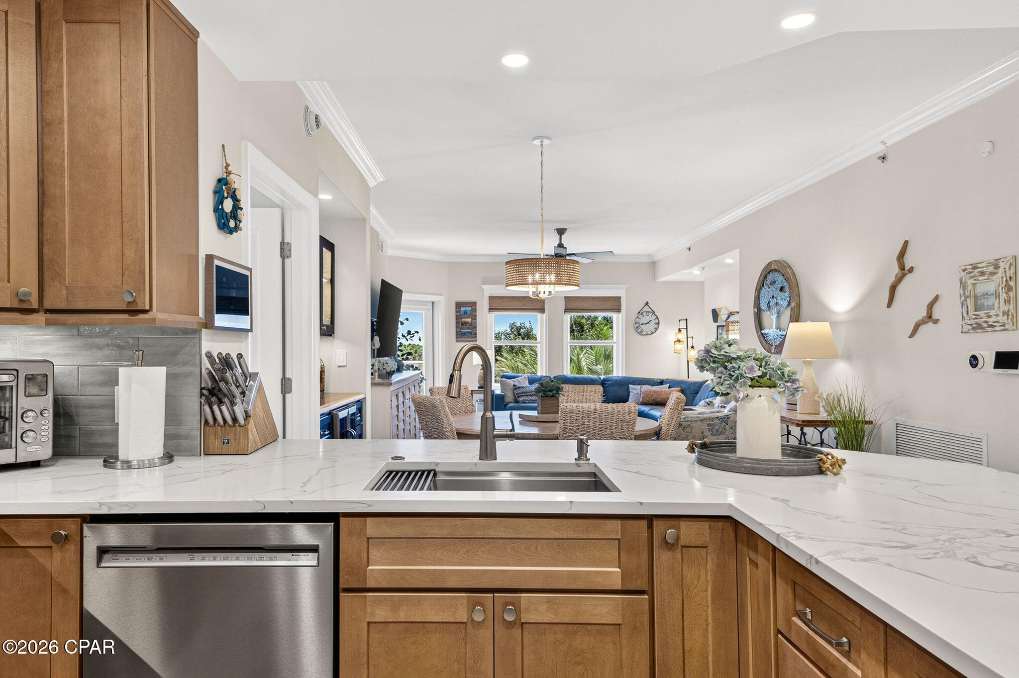 Welcome to luxury coastal living at The Grand! This beautifully remodeled 2-bedroom, 2-bath condo offers stunning views from the 5th floor overlooking the resort-style pool, the 5th hole of Bay Point Golf Club, the lagoon, and the natural beauty of St. Andrews State Park just across the water.
Completely renovated just two years ago, this exceptional unit stands out as the ONLY 2-bedroom floor plan in the building with an enlarged kitchen -- creating a spacious, open layout perfect for entertaining and everyday living. The beautifully updated kitchen features new cabinetry, gorgeous tile backsplash, updated appliances, and modern finishes throughout.
Additional upgrades include new flooring, fresh paint, designer light fixtures, tankless hot water heater, smart home features, and beautifully tiled bathrooms. A unique laundry closet relocation into the primary bathroom adds convenience and functionality, while pocket doors leading to the flex room provide added privacy and versatility.
Offered fully furnished and comfortably sleeping up to 8 guests, this condo is truly move-in ready -- making it an ideal full-time residence, vacation getaway, or investment opportunity.
Residents of The Grand enjoy an impressive list of amenities including a welcoming lobby, owners lounge, on-site mailboxes, fitness center, lanai with fireplace and game area, resort-style pool, hot tub, grilling area, and more. The unit also includes a covered deeded parking space and a climate controlled private storage unit for added convenience.
Whether you're relaxing on the balcony taking in the breathtaking views or enjoying the many amenities Bay Point has to offer, this condo delivers the perfect blend of comfort, style, and resort-inspired coastal living.