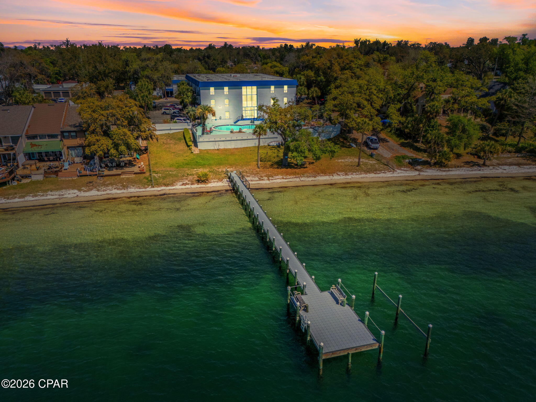 Wake up to breathtaking St. Andrews Bay views, relax by the waterfront pool, and enjoy direct access to a private dock and sandy beach area -- all less than one mile from Downtown Panama City and Harrison Avenue. Bay Club at St. Andrews offers an unbeatable combination of waterfront living, prime location, and exceptional value, with quick access to Eastern Shipbuilding, Tyndall Air Force Base, and the white-sand beaches of Panama City Beach.

This 2-bedroom, 2-bath condo offers comfortable, low-maintenance living just steps from the beautiful waters of St. Andrews Bay.

Enjoy hassle-free living with a simple $75 monthly utility package that includes water, sewer, trash, cable, and pest control -- giving you added convenience and fewer bills to manage each month.

With an open living area filled with natural light, the space feels welcoming and relaxed -- ideal for quiet evenings at home or entertaining guests.

Enjoy peaceful mornings with coffee near the water and stunning sunsets right outside your door.

Bay Club is known for its laid-back coastal atmosphere, mature oak trees, and scenic bayfront setting. Residents can enjoy community amenities including a waterfront pool, private dock, beach area, and outdoor spaces perfect for relaxing, fishing, kayaking, or soaking up the Florida sunshine. While the community offers its own private beach area, you're also only approximately 11 miles from the world-famous beaches of Panama City Beach.

The location is ideal for both convenience and lifestyle -- situated less than 1 mile from Downtown Panama City/Harrison Avenue, approximately 3.7 miles from Eastern Shipbuilding, and approximately 10.4 miles from Tyndall Air Force Base.

The community also offers one assigned parking space along with plenty of guest overflow parking for added convenience.

Whether you're looking for a full-time residence or a coastal retreat, this condo offers the perfect blend of convenience, charm, amenities, and waterfront lifestyle.

Don't miss the opportunity to enjoy bayfront living in one of Panama City's most sought-after locations. Contact us today for more information or to schedule a showing!