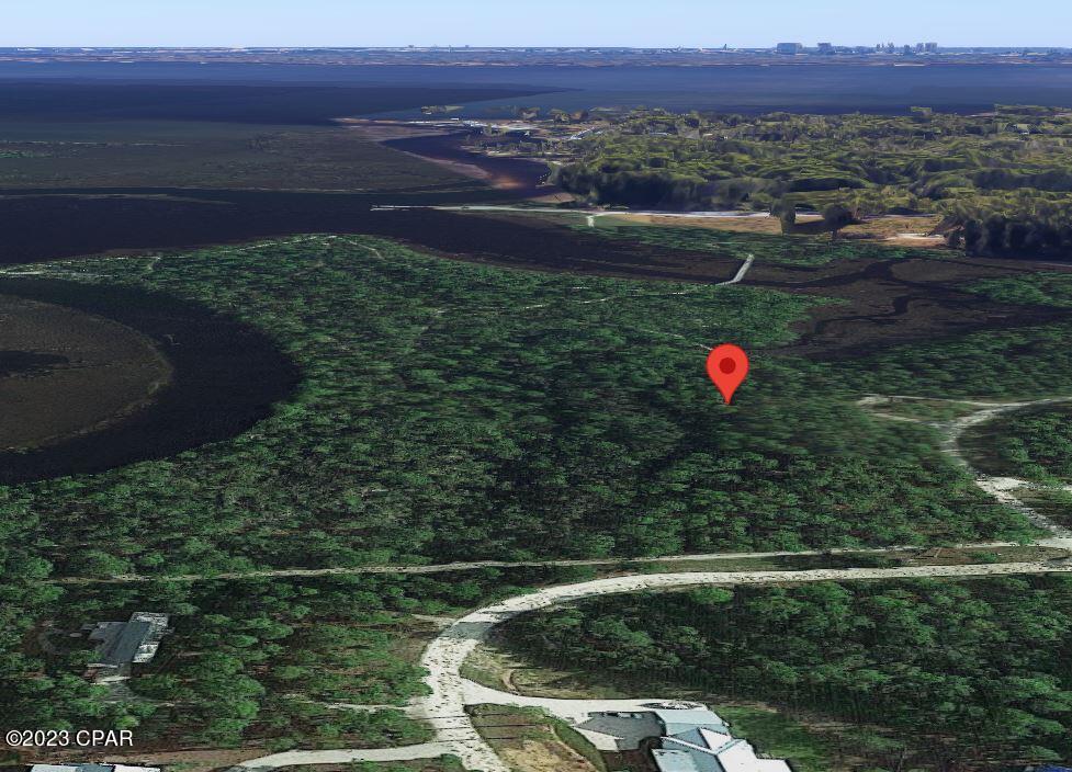 Incredible price on this .59 acre Lot on a very private road in the exclusive, gated community of RiverCamps. Conveniently located to the connected 7 mile trail system this Lot provides a large buildable area for your dream home. Property owners enjoy a private boat ramp that leads into the 18000 acre West Bay and a short 30 minute boat ride to Shell Island and the Gulf of Mexico. Owners also enjoy dry-boat storage, day-use boat slips, unlimited use of canoes, kayaks, paddleboards and bicycles. RiverCamps is a gated 1500 acre oasis designed for the outdoor enthusiast. With less than 450 homesites planned on 500 acres the remaining 1000 acres are committed to conservation. Close to the famous white sandy beaches yet far from the traffic and crowds.